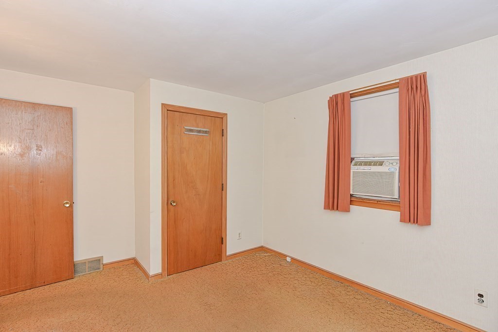 209 3rd Street Stoughton, MA 02072 - Photo 24 of 36 a view of an empty room with a window