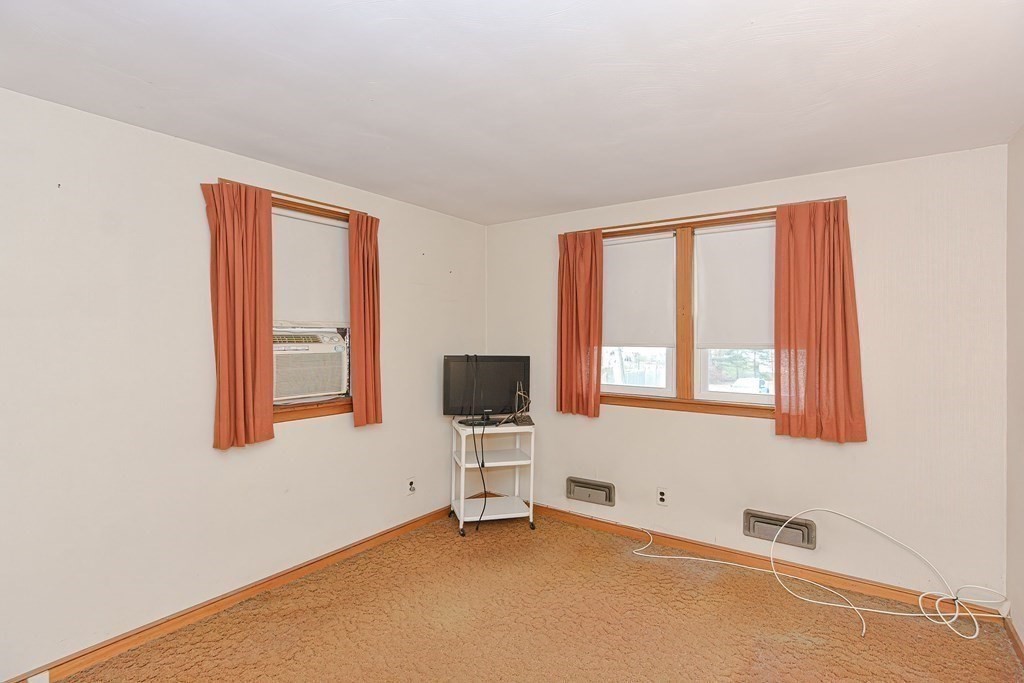 209 3rd Street Stoughton, MA 02072 - Photo 25 of 36 a view of an empty room with a window