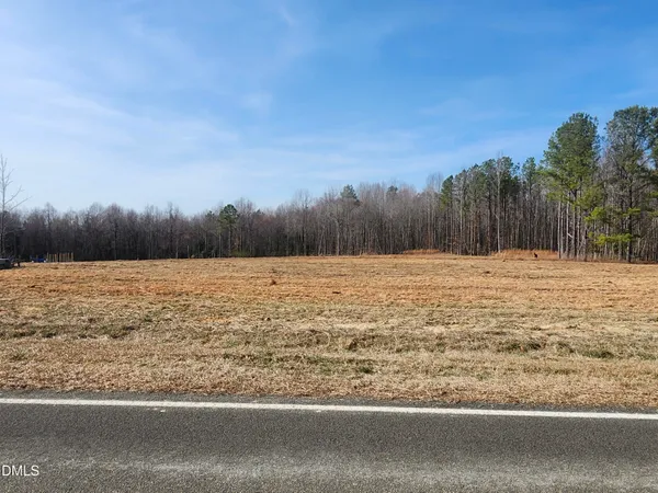 a view of a yard with an ocean view