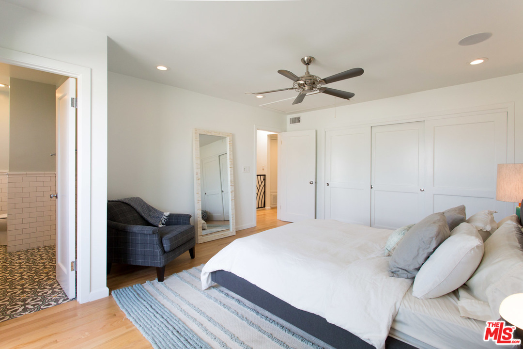 631 Strand Street, Unit 2 Santa Monica, CA 90405 - Photo 13 of 30 a bed room with a bed and furniture