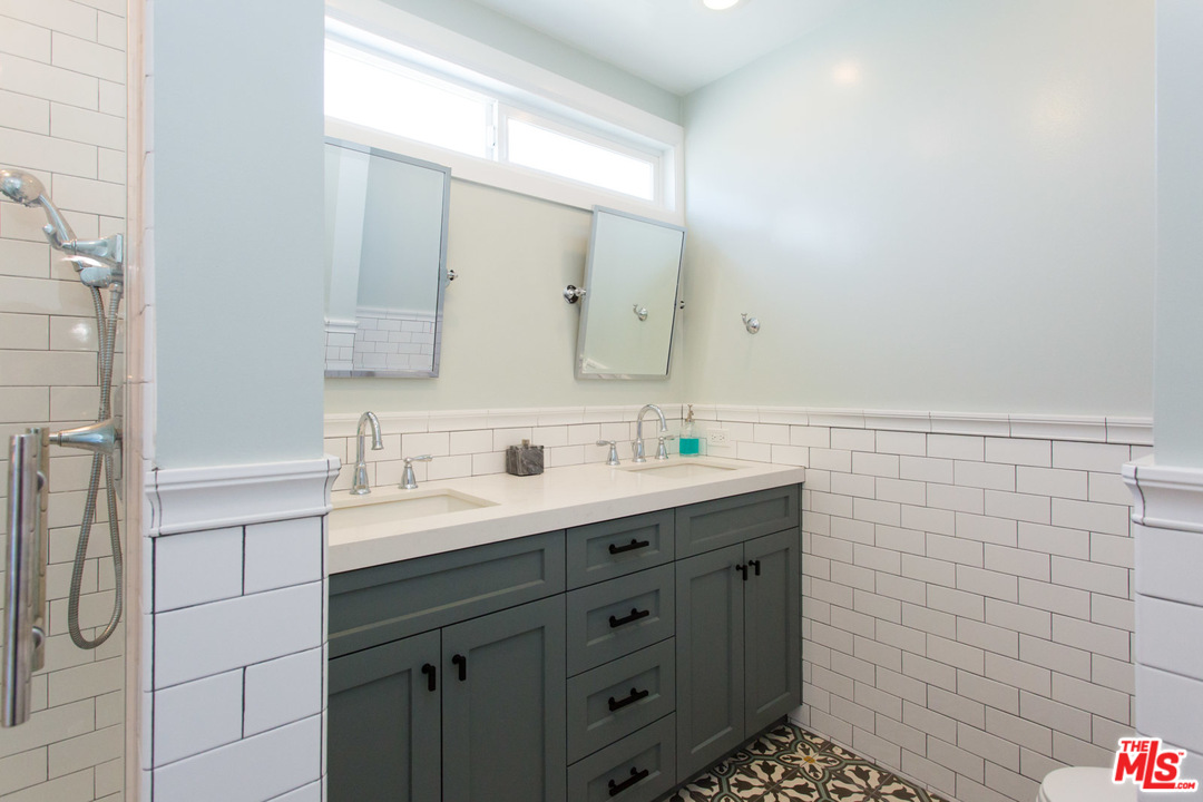 631 Strand Street, Unit 2 Santa Monica, CA 90405 - Photo 14 of 30 a bathroom with a sink a vanity and a mirror