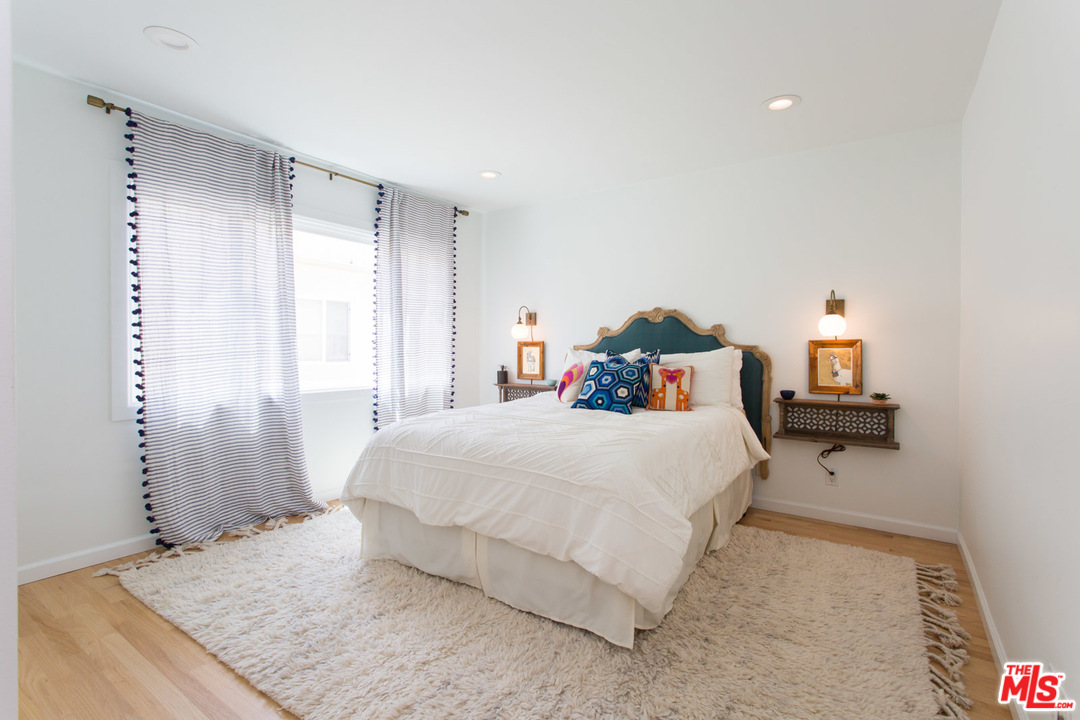 631 Strand Street, Unit 2 Santa Monica, CA 90405 - Photo 21 of 30 a bedroom with a bed and a table