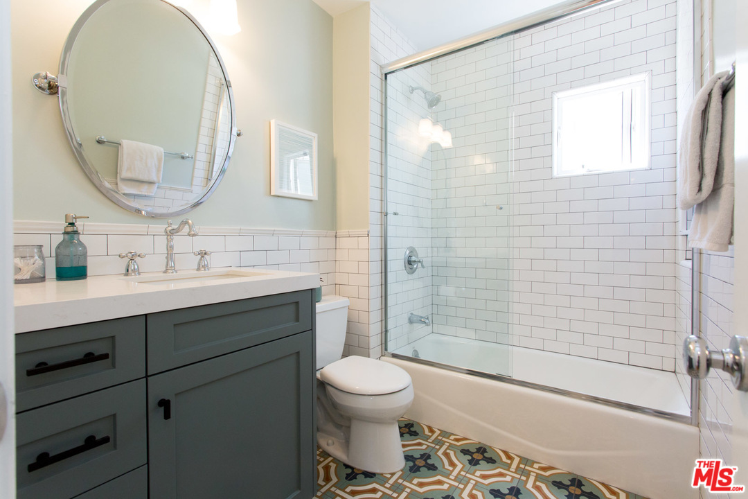 631 Strand Street, Unit 2 Santa Monica, CA 90405 - Photo 22 of 30 a bathroom with a sink toilet a shower and a mirror