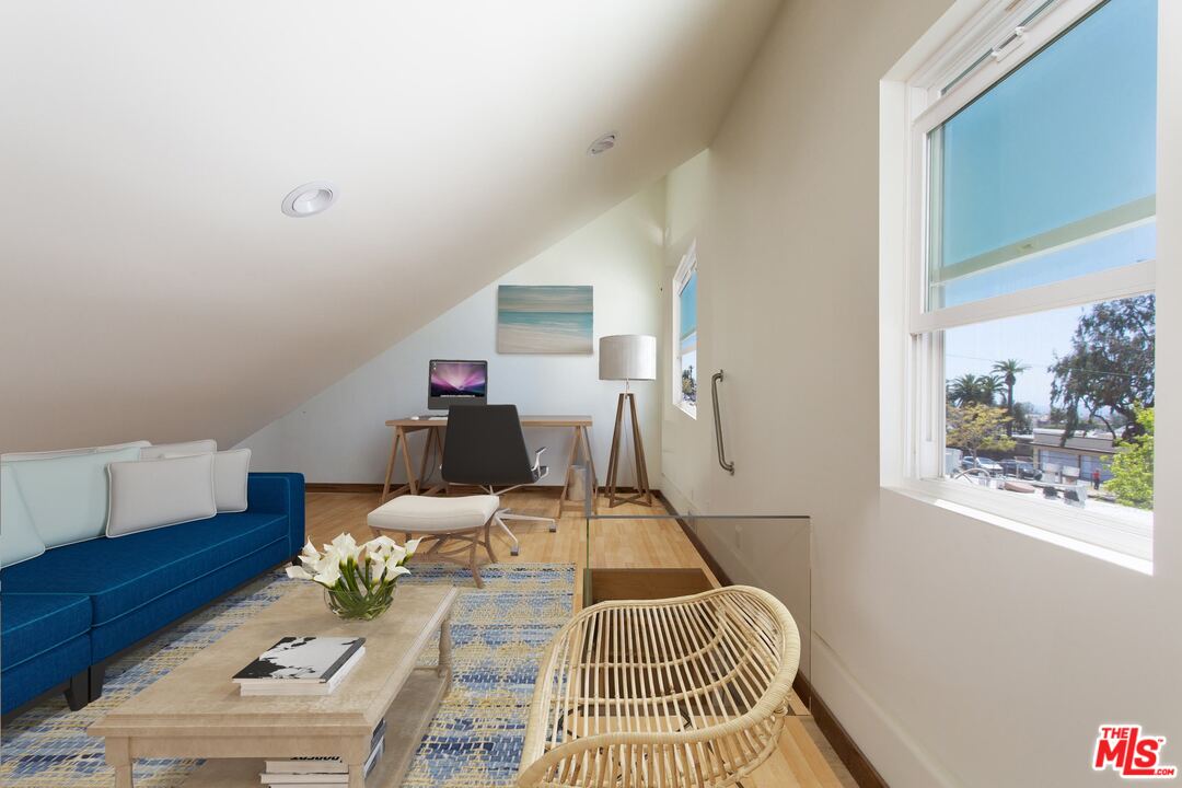 631 Strand Street, Unit 2 Santa Monica, CA 90405 - Photo 23 of 30 a living room with furniture and a window