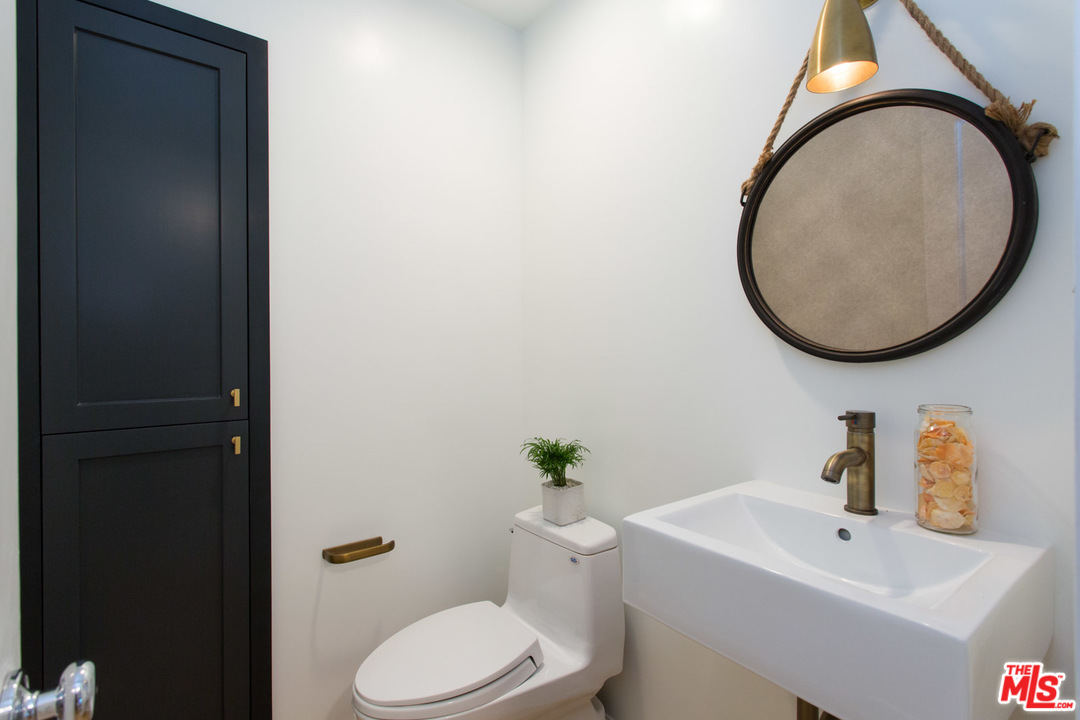 631 Strand Street, Unit 2 Santa Monica, CA 90405 - Photo 10 of 30 a bathroom with a sink and a mirror