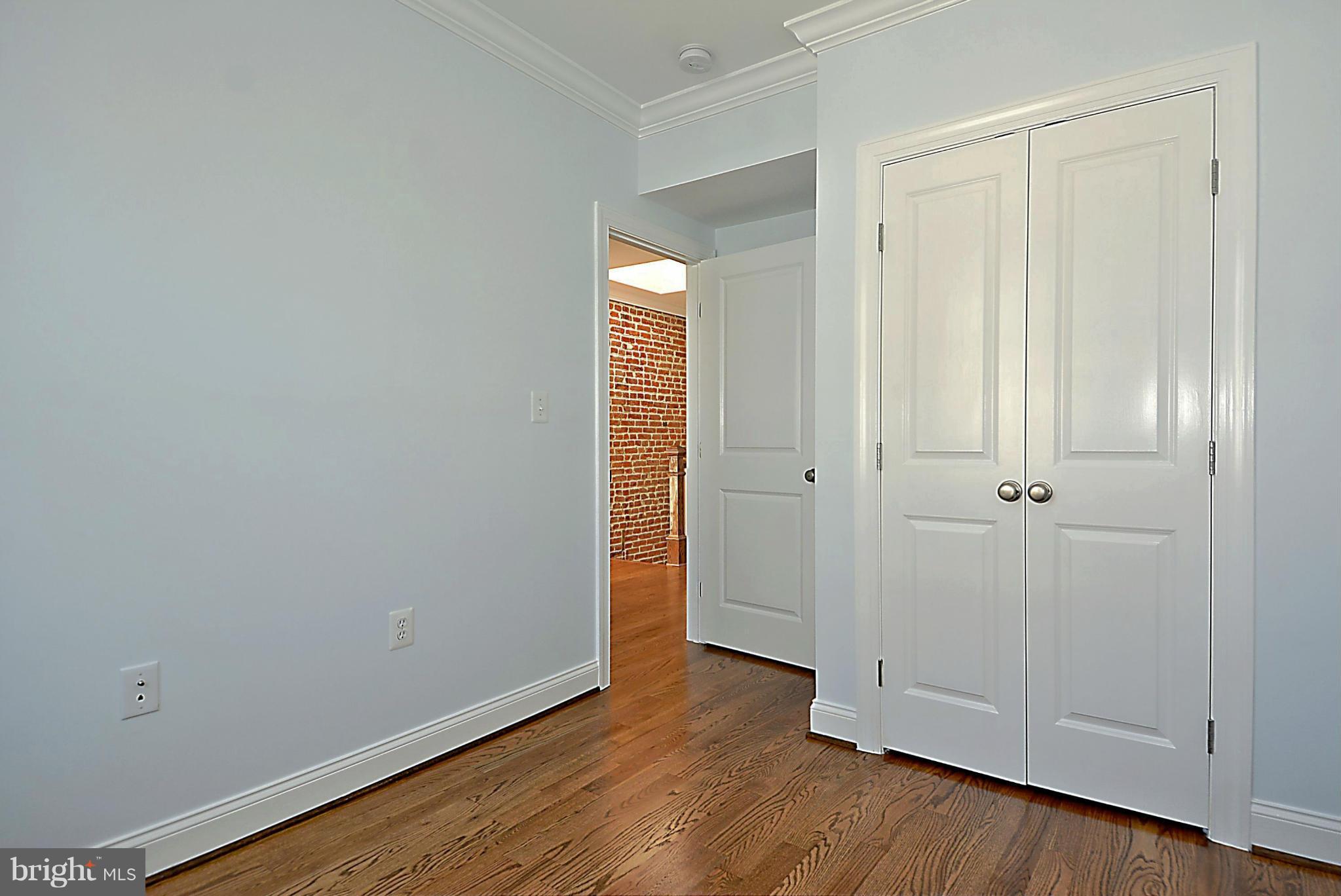 1102 4th Street Northeast Washington, DC 20002 - Photo 11 of 17 a view of an empty room with wooden floor