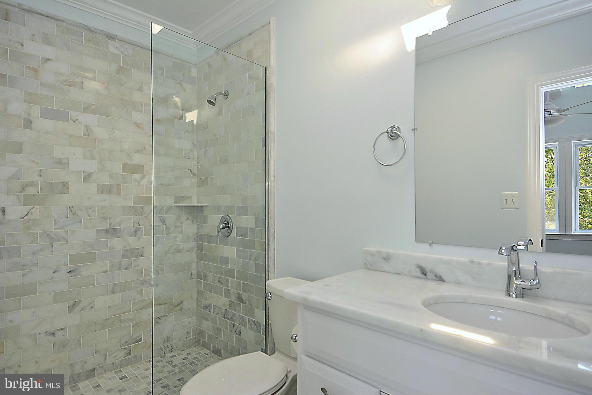 1102 4th Street Northeast Washington, DC 20002 - Photo 13 of 17 a bathroom with a sink toilet and shower