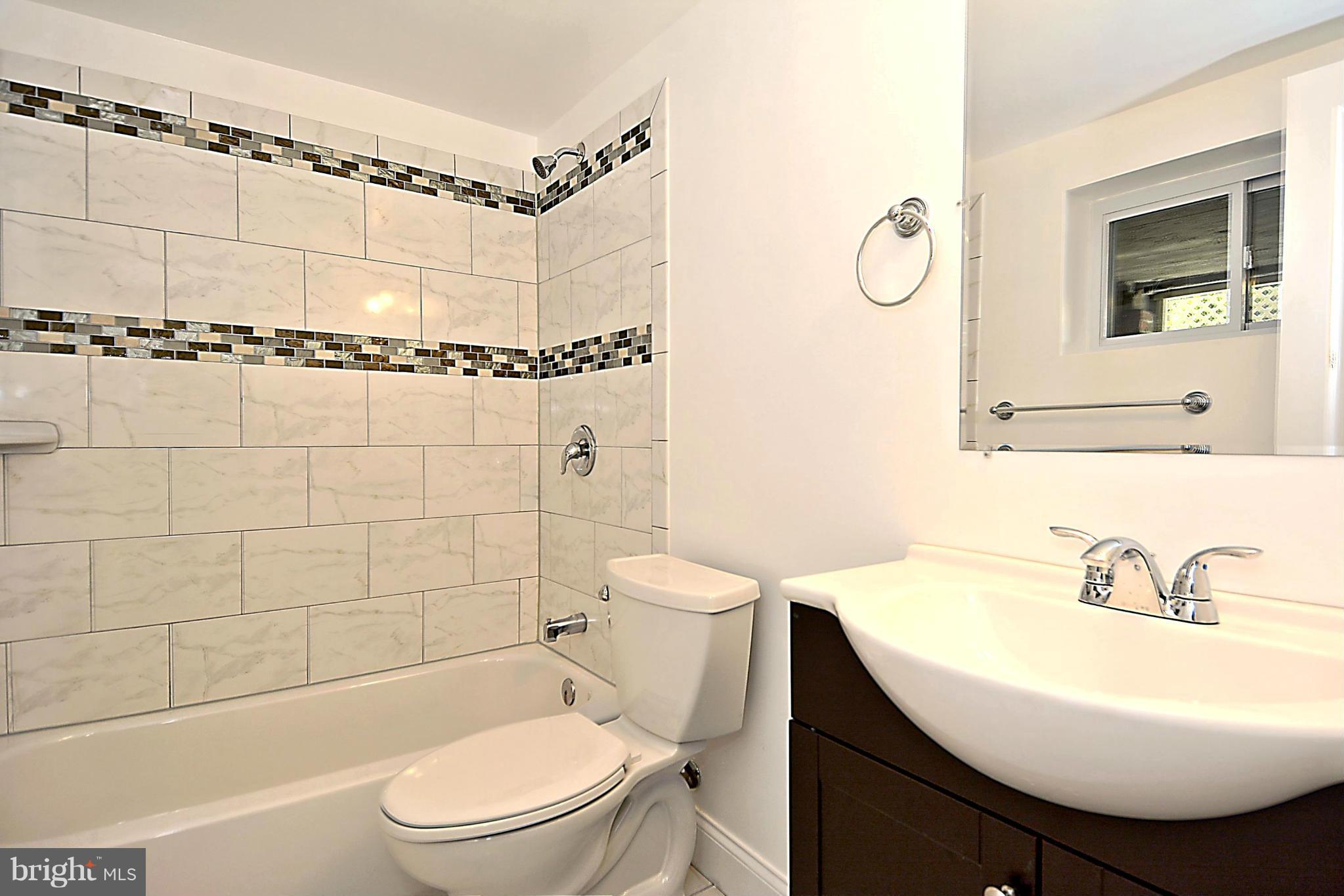 1102 4th Street Northeast Washington, DC 20002 - Photo 15 of 17 a bathroom with a sink toilet and shower