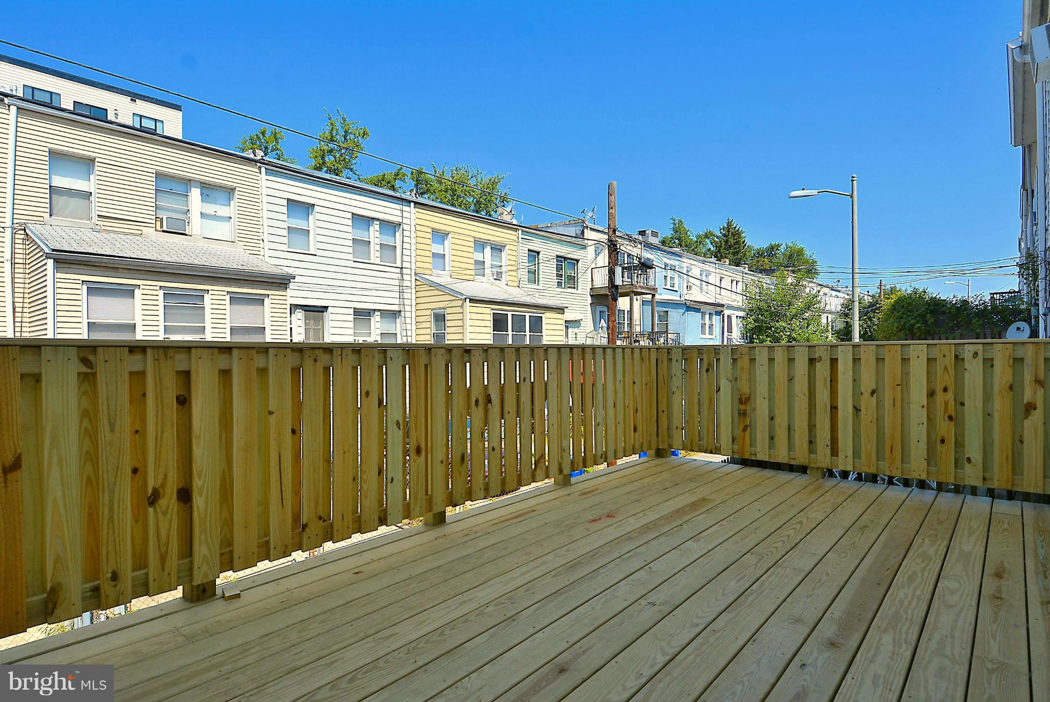 1102 4th Street Northeast Washington, DC 20002 - Photo 16 of 17 a view of a balcony with wooden floor and fence