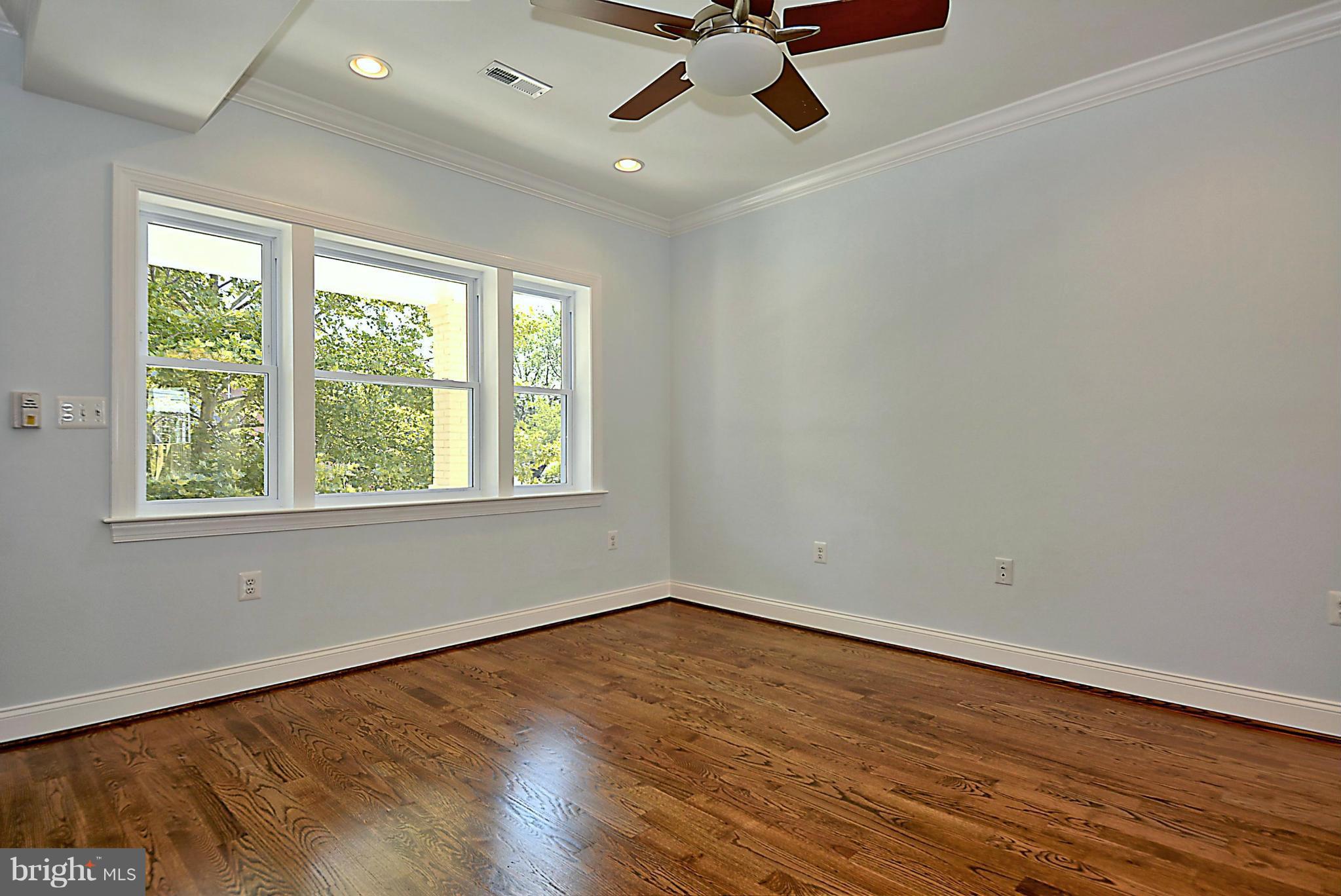 1102 4th Street Northeast Washington, DC 20002 - Photo 4 of 17 wooden floor in an empty room with a window