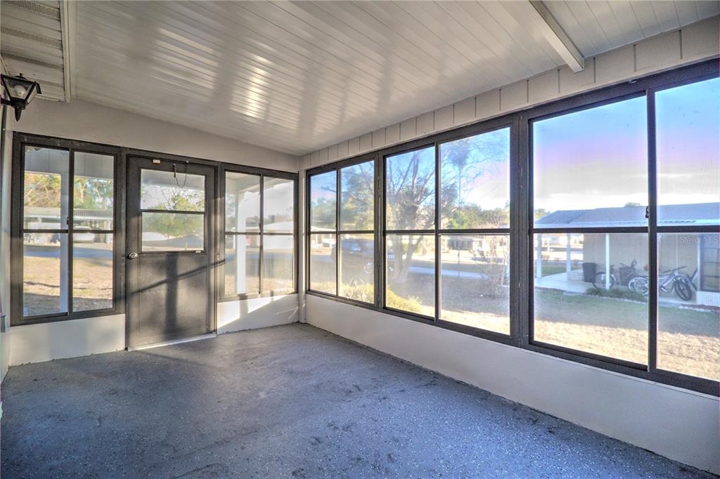 10182 Southwest 87th Terrace Ocala, FL 34481 - Photo 18 of 26 a view of an empty room with a large window