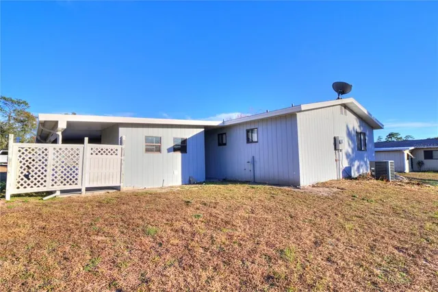 a view of swimming pool with a yard and seating space