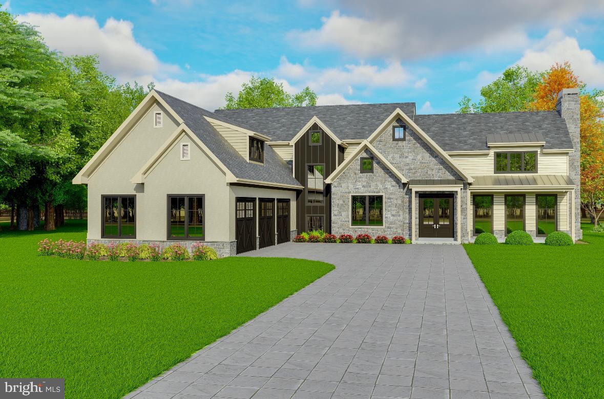 a front view of a house with a yard and trees