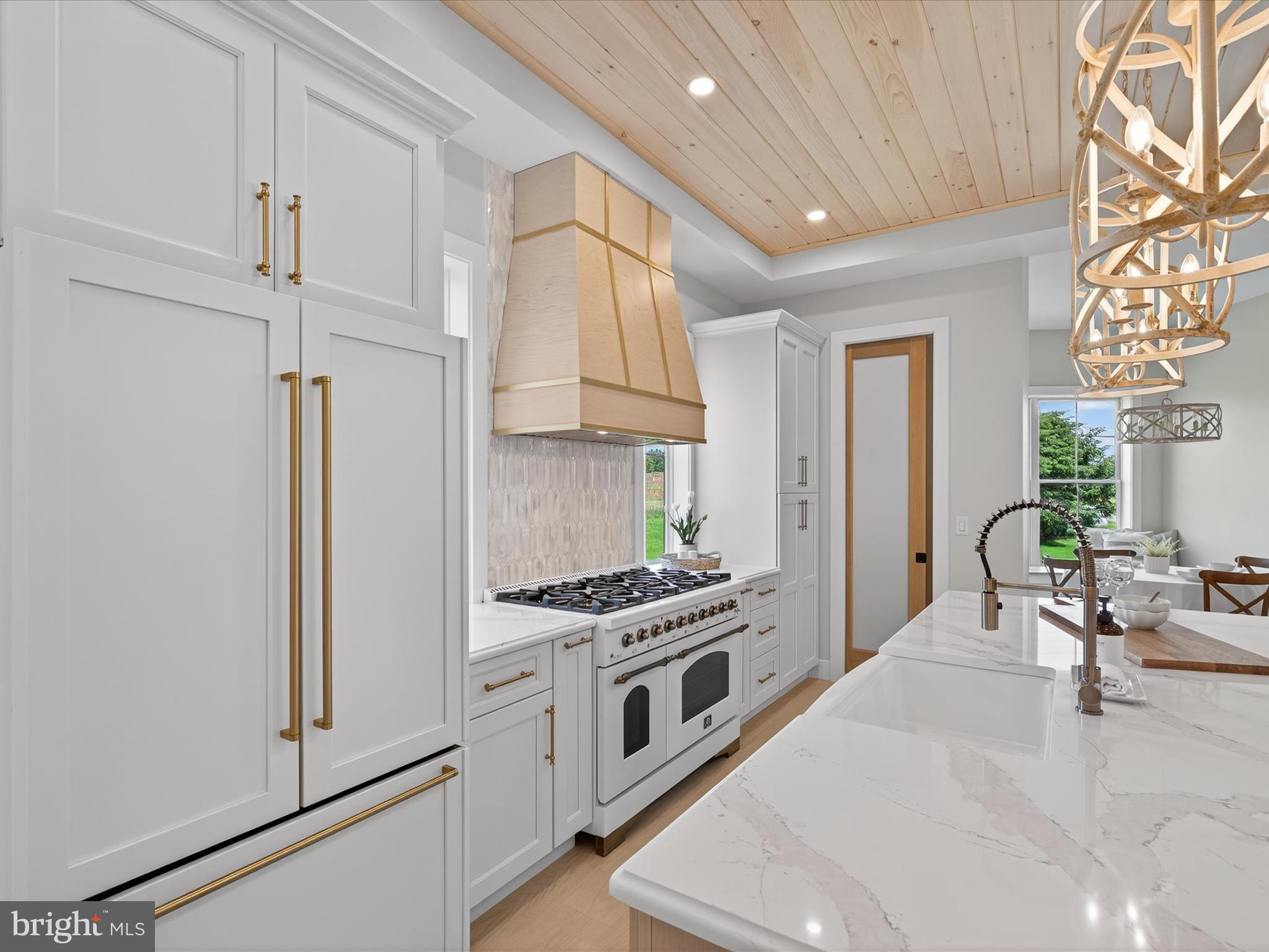 297 Sarsen Drive Lititz, PA 17543 - Photo 20 of 67 a kitchen with stainless steel appliances a stove a sink and a refrigerator