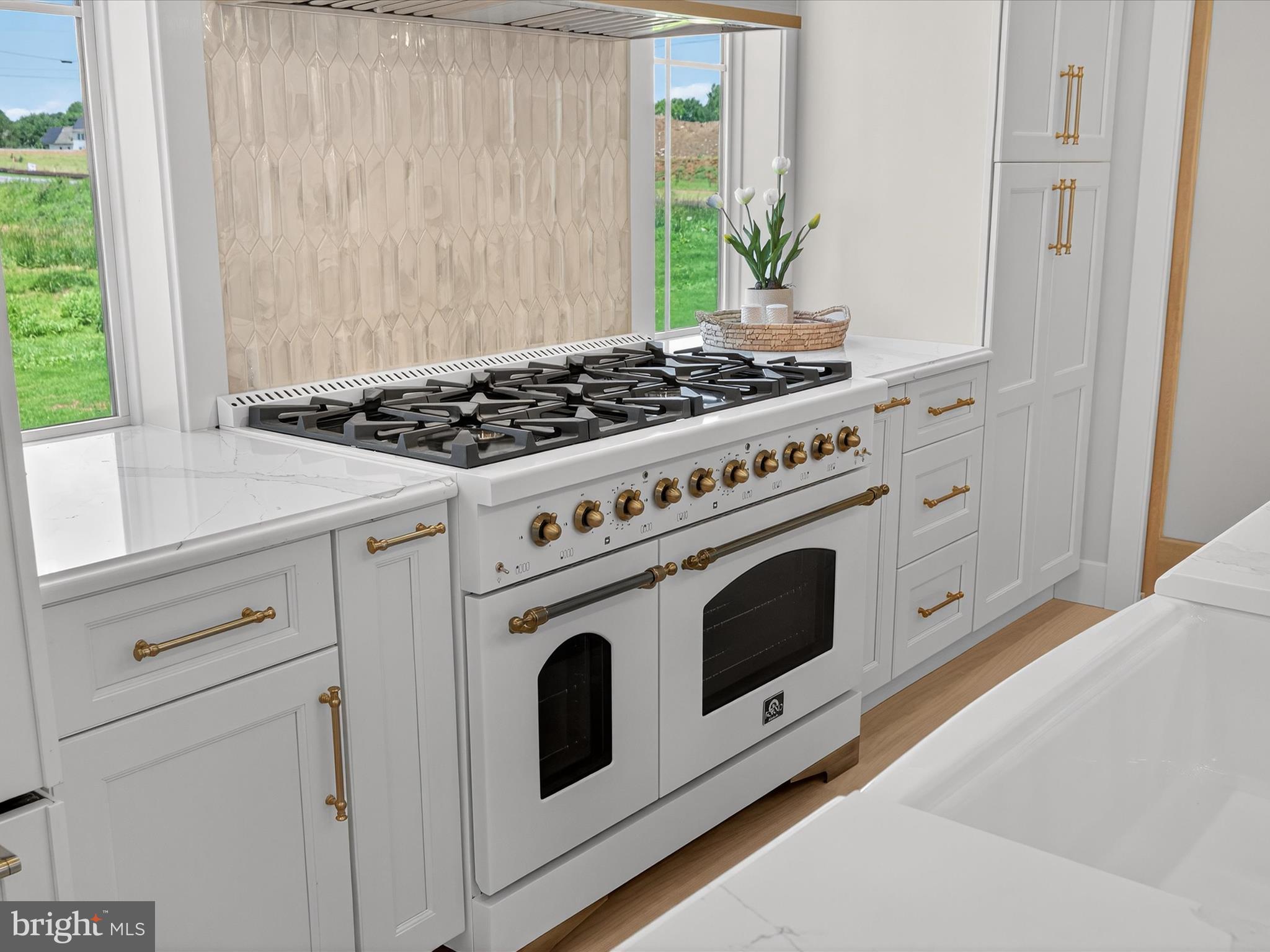 297 Sarsen Drive Lititz, PA 17543 - Photo 21 of 67 a white stove top oven sitting inside of a kitchen