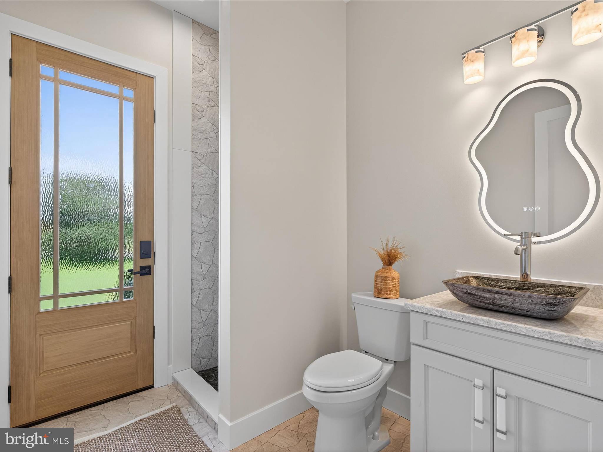 297 Sarsen Drive Lititz, PA 17543 - Photo 31 of 67 a bathroom with a toilet a sink and mirror