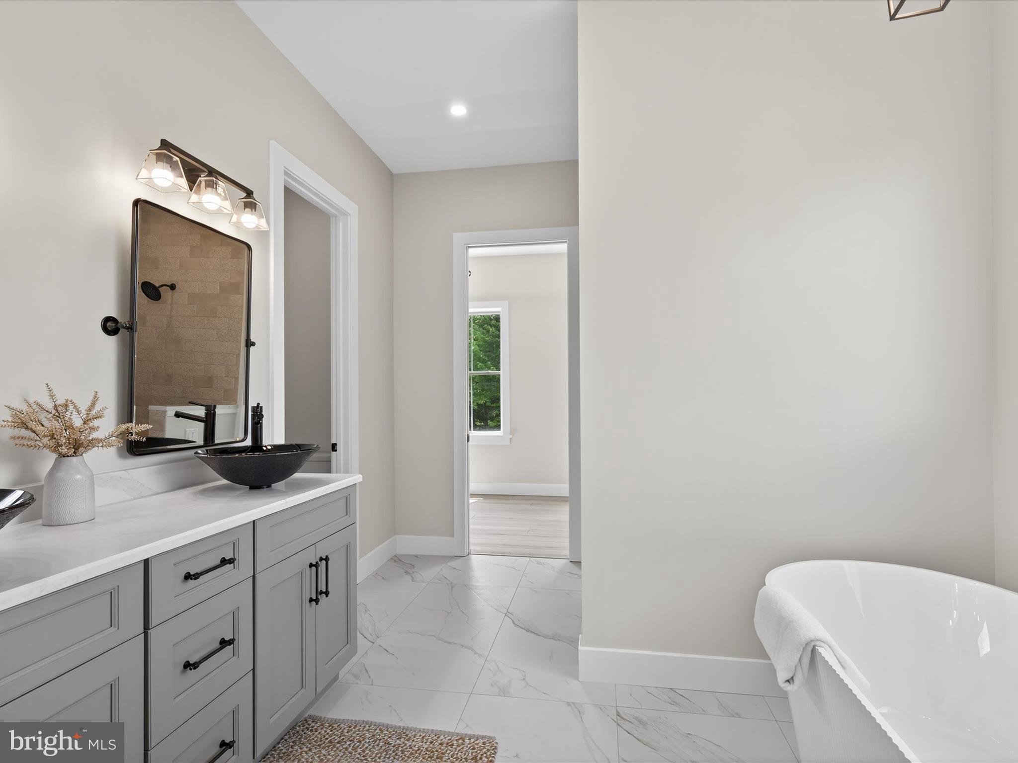 297 Sarsen Drive Lititz, PA 17543 - Photo 36 of 67 a bathroom with a granite countertop sink and a mirror