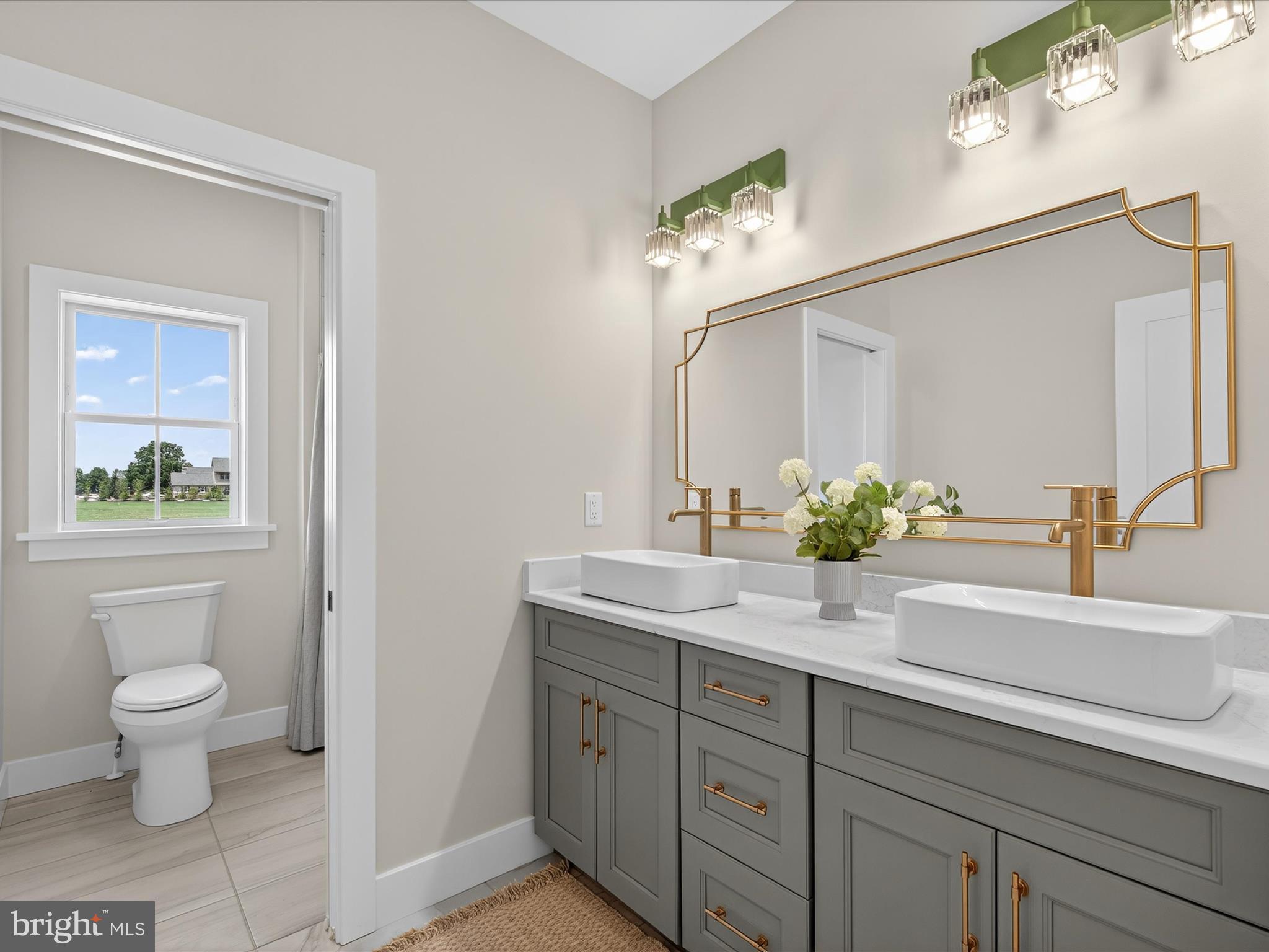 297 Sarsen Drive Lititz, PA 17543 - Photo 45 of 67 a bathroom with a toilet sink and mirror