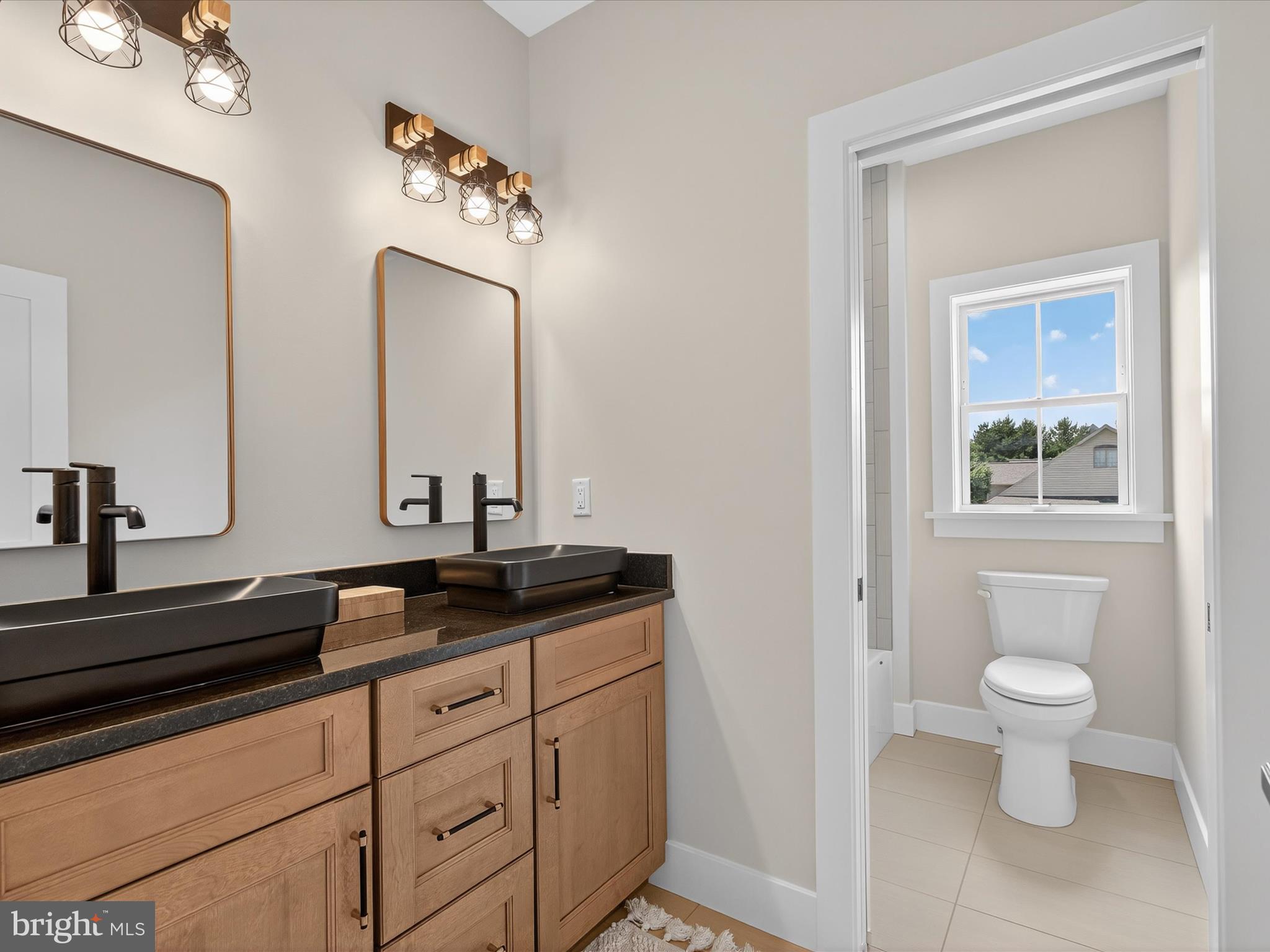 297 Sarsen Drive Lititz, PA 17543 - Photo 51 of 67 a bathroom with a toilet sink and mirror