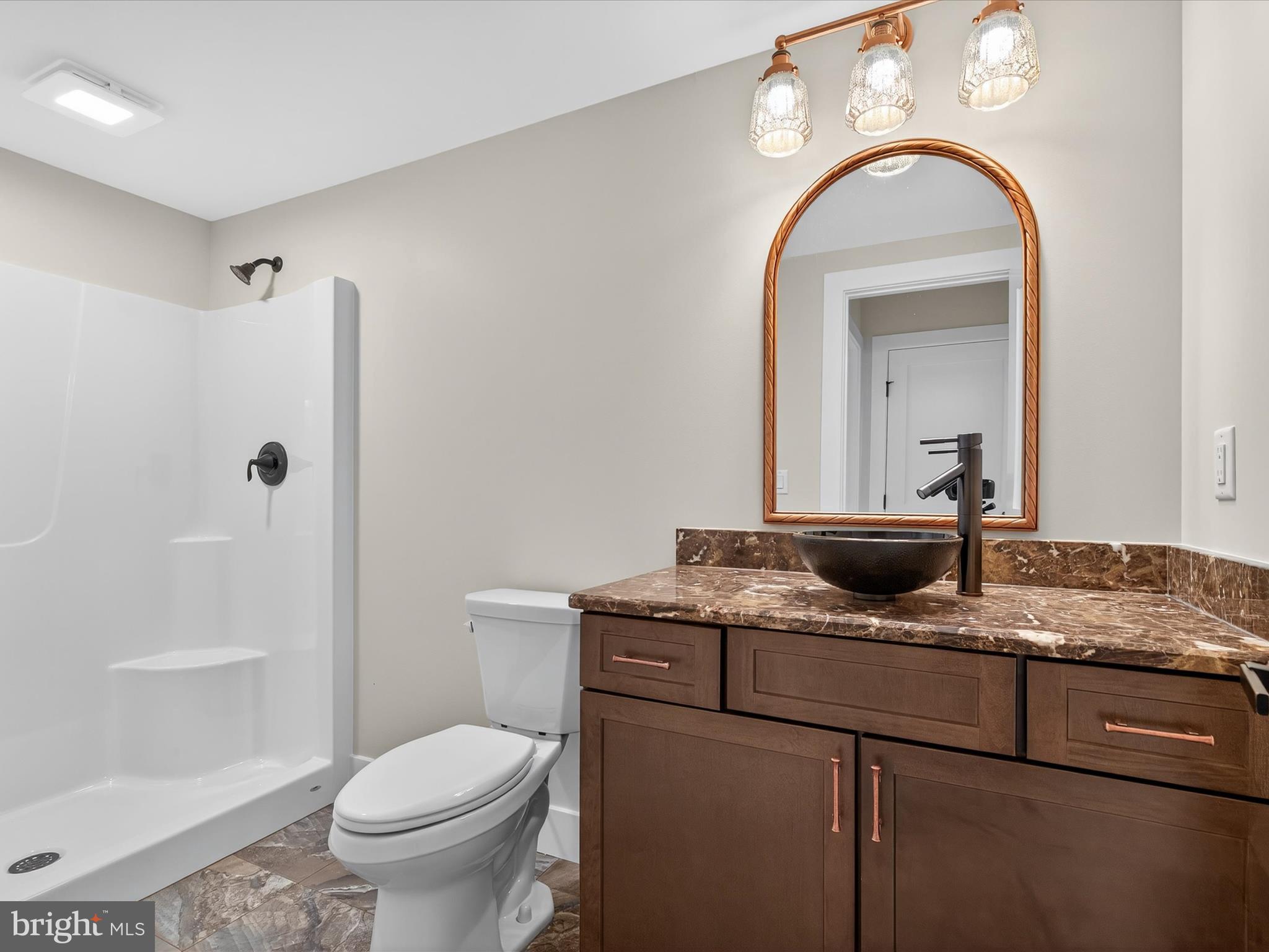 297 Sarsen Drive Lititz, PA 17543 - Photo 58 of 67 a bathroom with a granite countertop sink toilet and shower