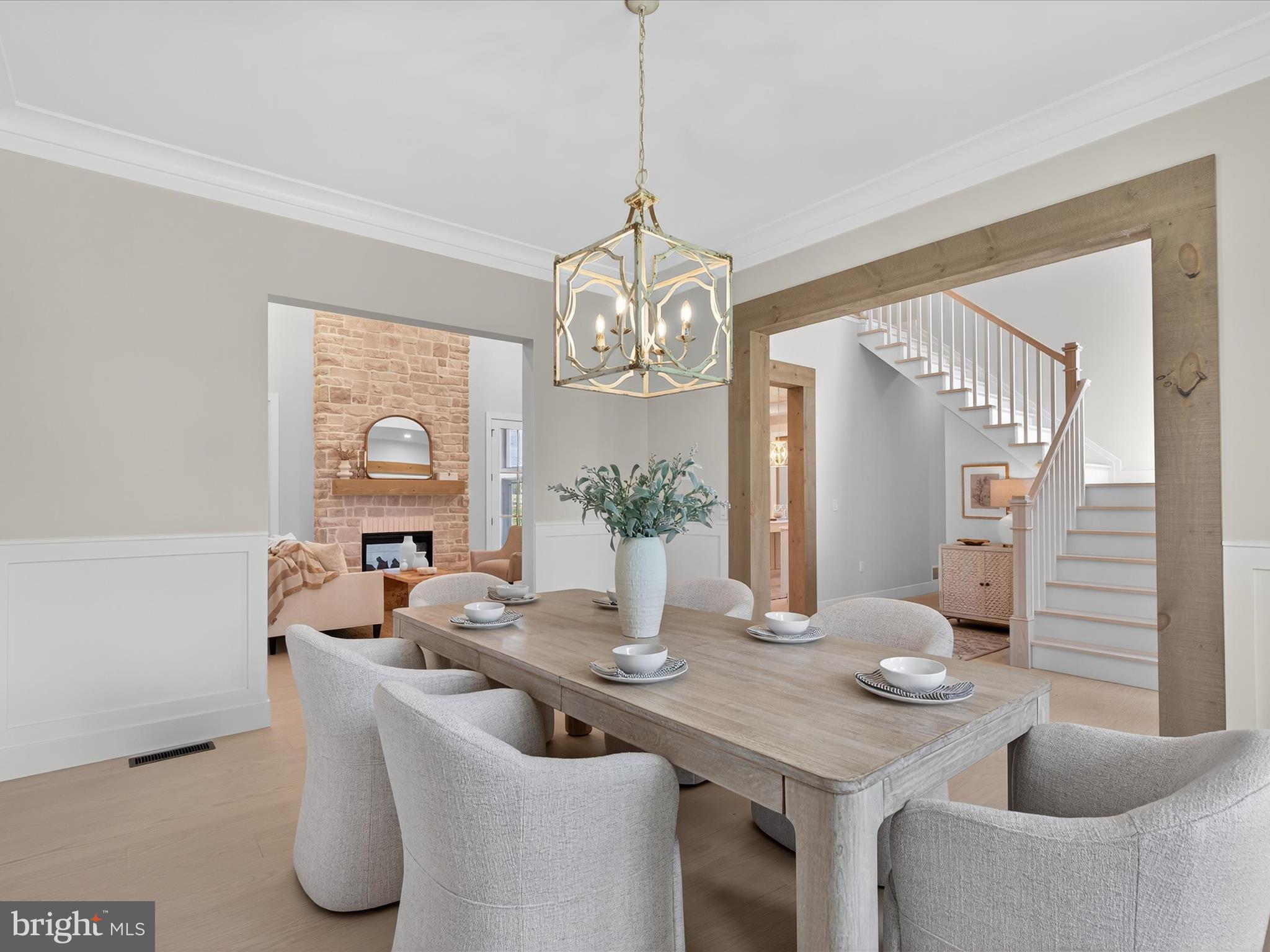297 Sarsen Drive Lititz, PA 17543 - Photo 9 of 67 a dining room with furniture a chandelier and wooden floor