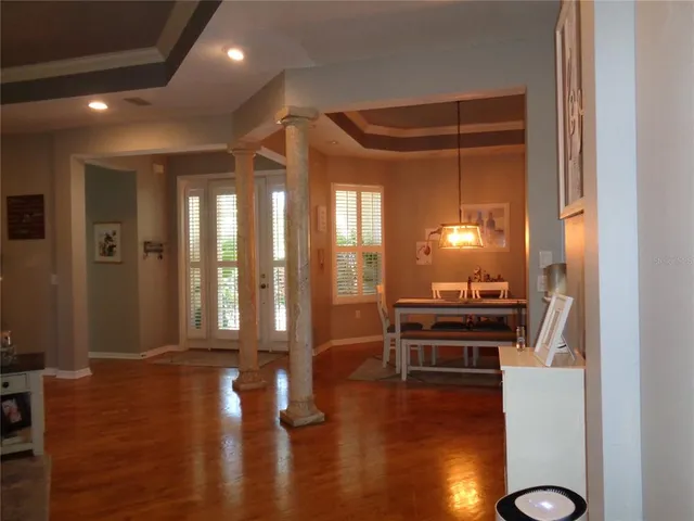 a view of a livingroom with furniture and hardwood floor