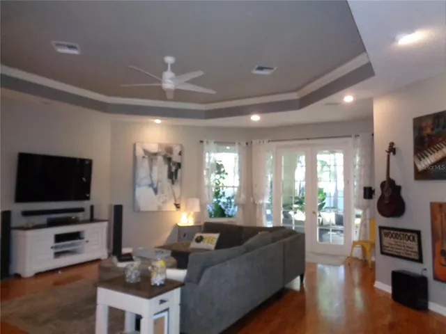 a living room with fireplace furniture and a flat screen tv