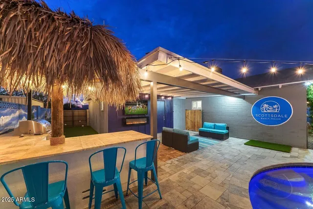 a view of a chairs and table in patio