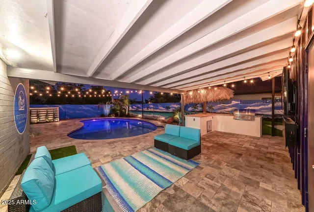 a view of a living room and kitchen