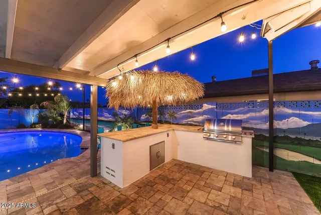 a kitchen with stainless steel appliances granite countertop a sink and cabinets