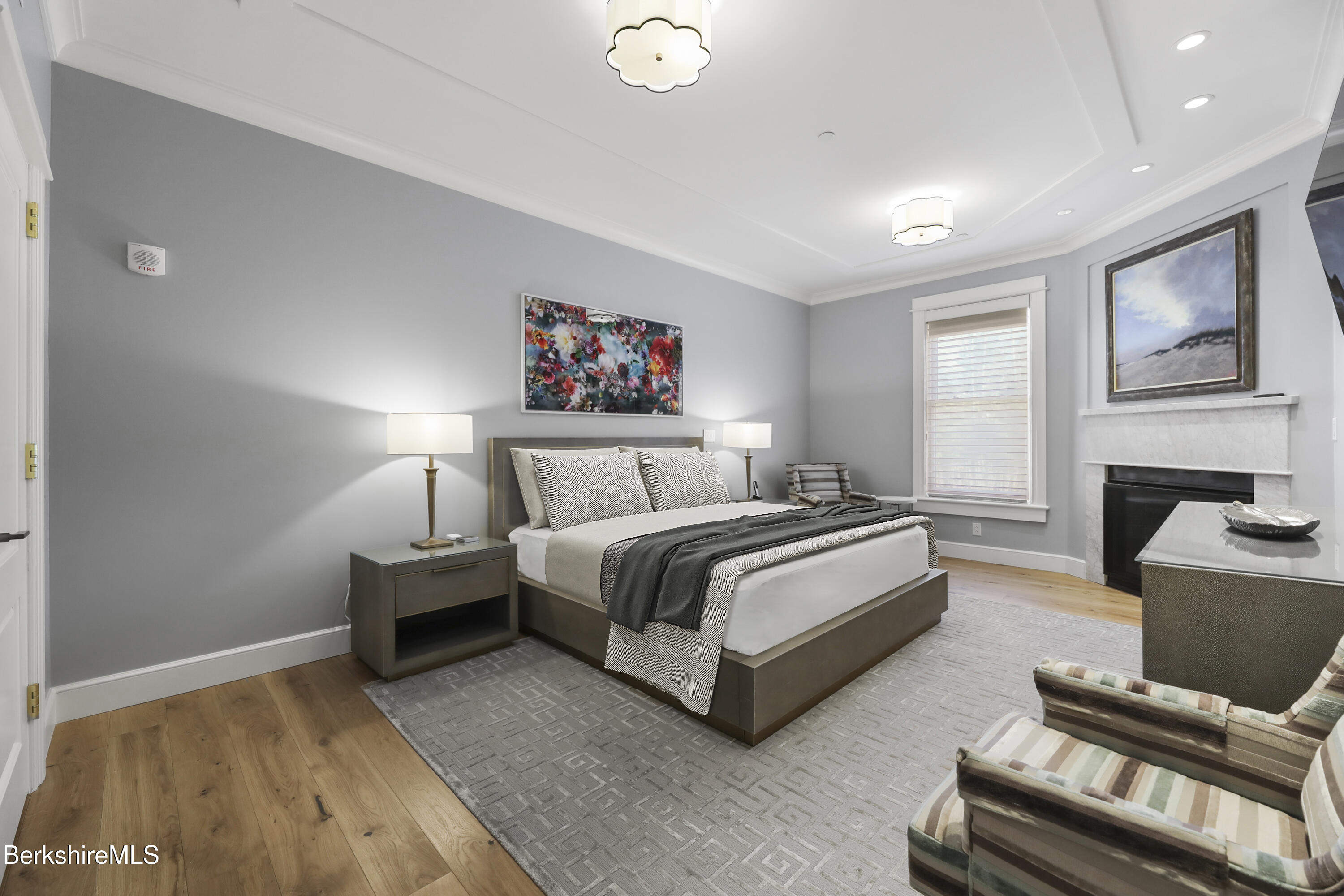 165 Kemble Street, Unit 10 Lenox, MA 01240 - Photo 12 of 24 a spacious bedroom with a bed and a couch