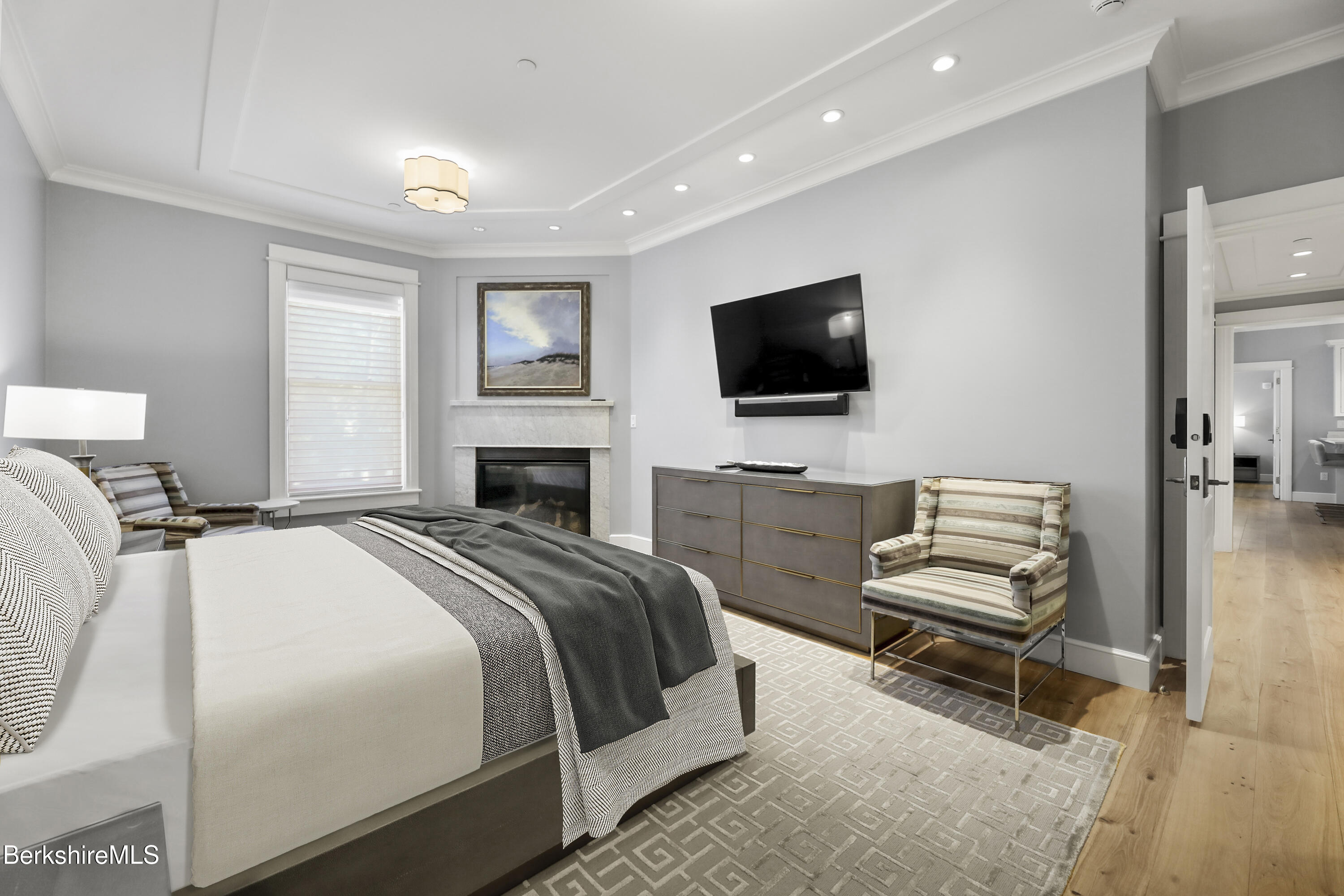 165 Kemble Street, Unit 10 Lenox, MA 01240 - Photo 13 of 24 a bedroom with a bed and a flat screen tv