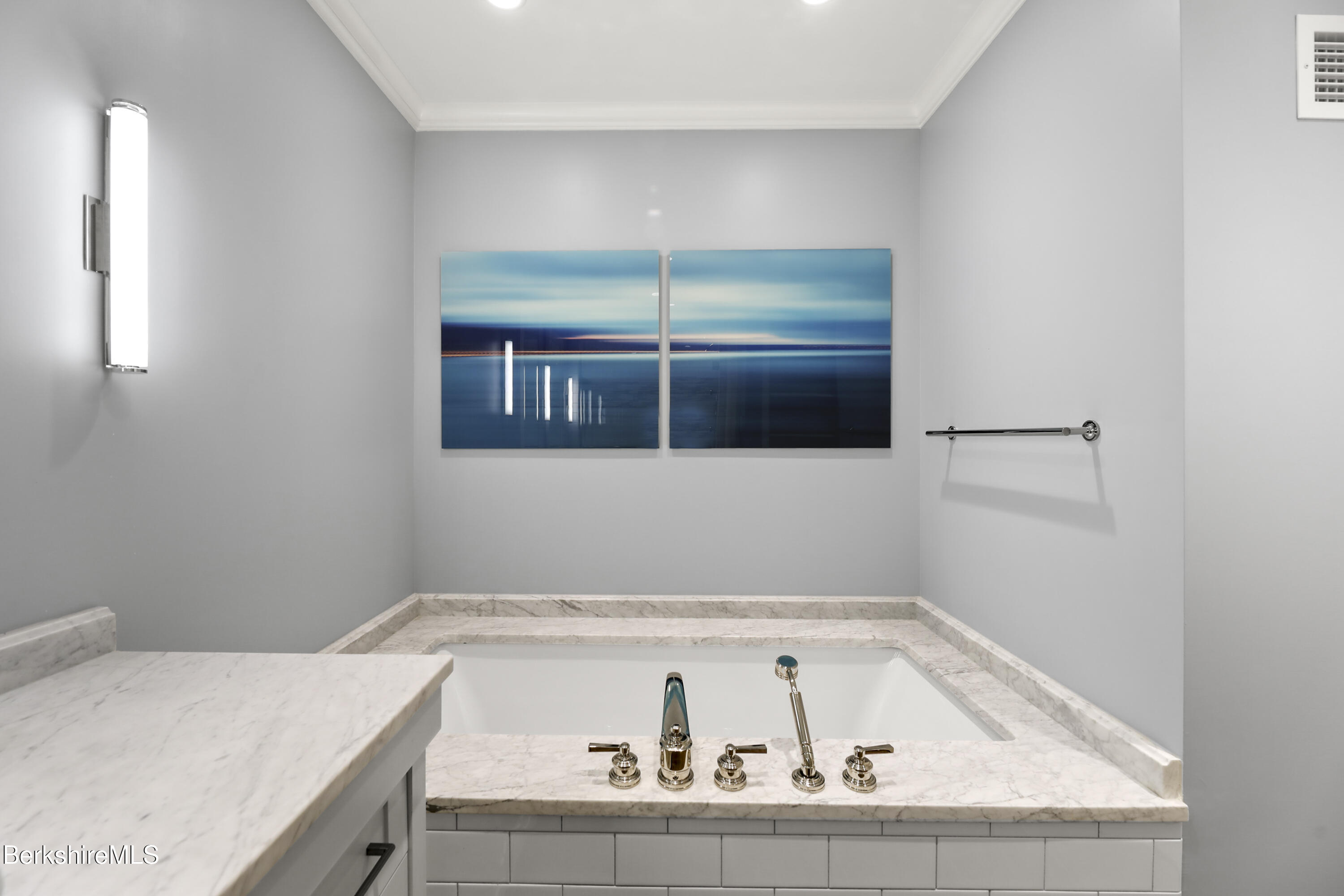 165 Kemble Street, Unit 10 Lenox, MA 01240 - Photo 16 of 24 a bathroom with a bathtub and a window