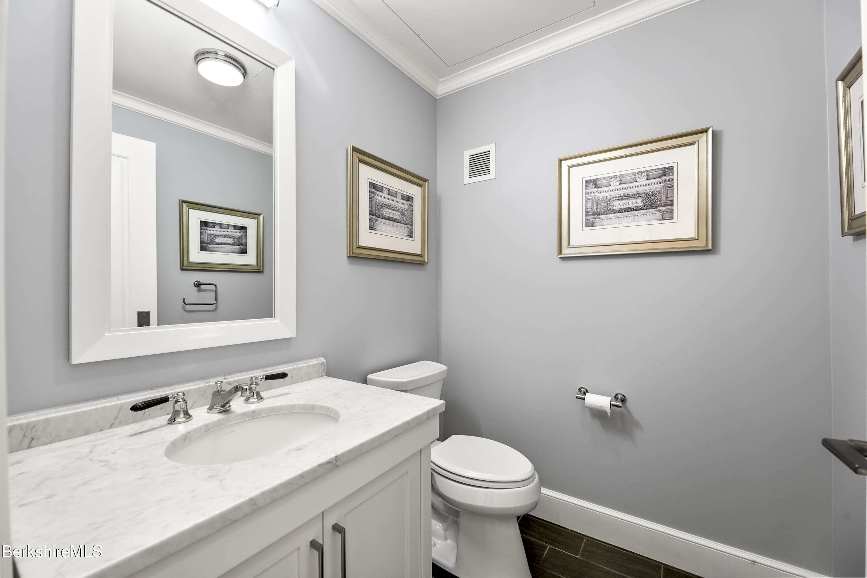 165 Kemble Street, Unit 10 Lenox, MA 01240 - Photo 19 of 24 a bathroom with a toilet sink and mirror