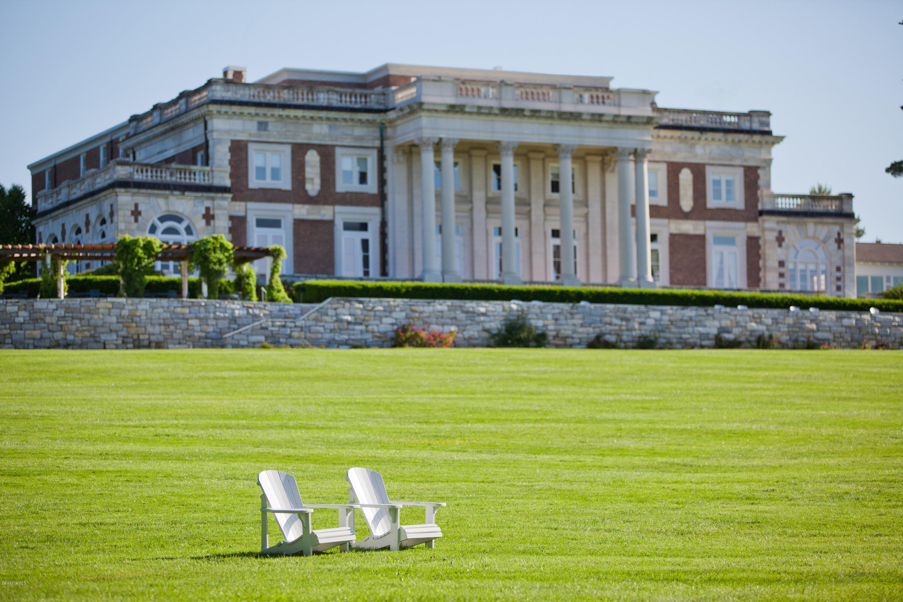 165 Kemble Street, Unit 10 Lenox, MA 01240 - Photo 24 of 24 a front view of a house with a big yard
