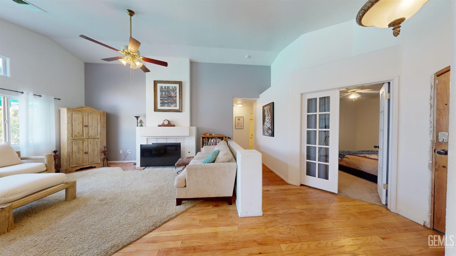 Undisclosed Address Bakersfield, CA 93313 - Photo 12 of 37 a living room with furniture and a fireplace