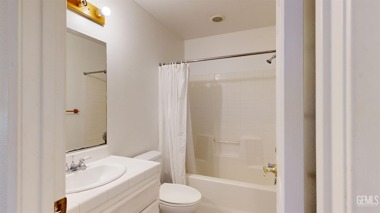 Undisclosed Address Bakersfield, CA 93313 - Photo 17 of 37 a bathroom with a sink toilet and shower