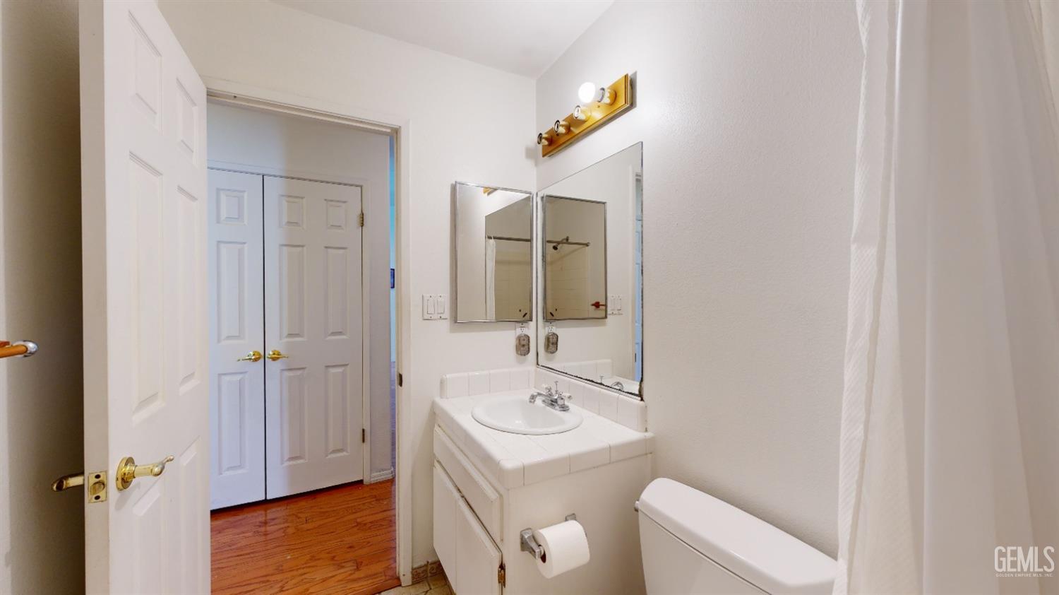 Undisclosed Address Bakersfield, CA 93313 - Photo 18 of 37 a bathroom with a sink a toilet and shower