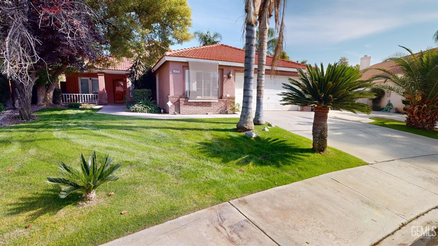 Undisclosed Address Bakersfield, CA 93313 - Photo 2 of 37 a front view of a house with garden