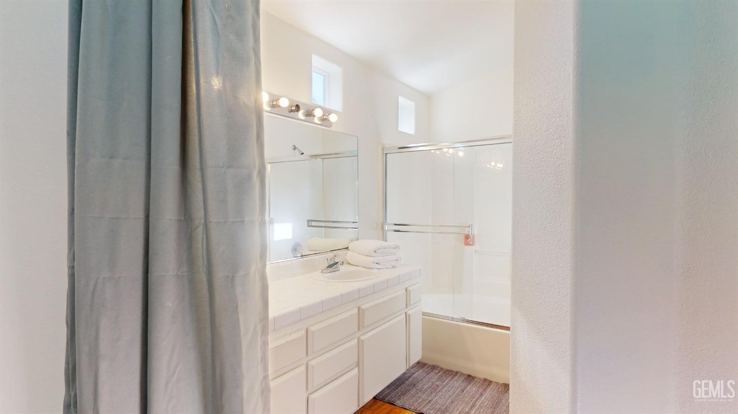 Undisclosed Address Bakersfield, CA 93313 - Photo 22 of 37 a bathroom with a sink a toilet and shower