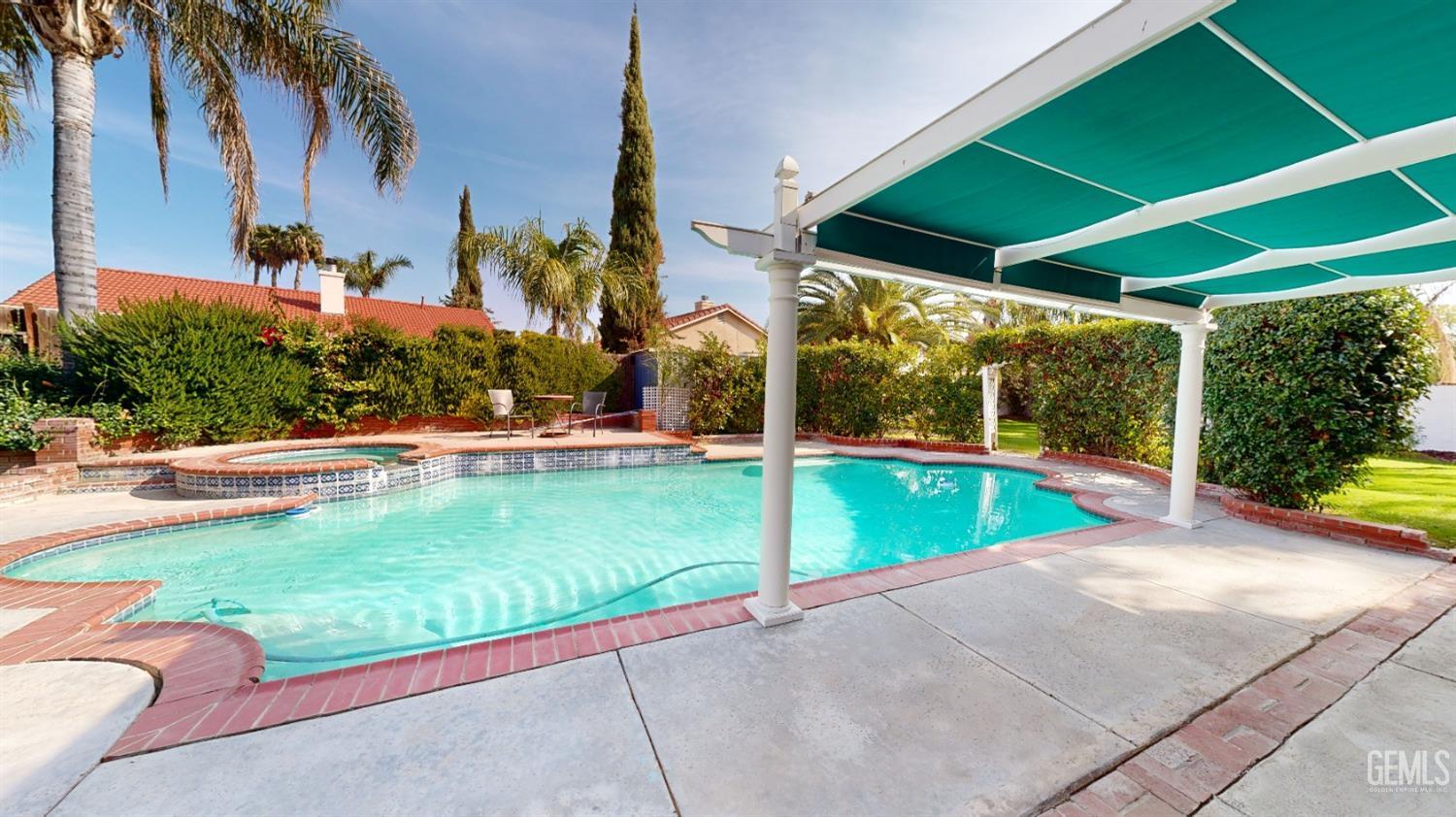 Undisclosed Address Bakersfield, CA 93313 - Photo 27 of 37 a view of outdoor space yard and swimming pool