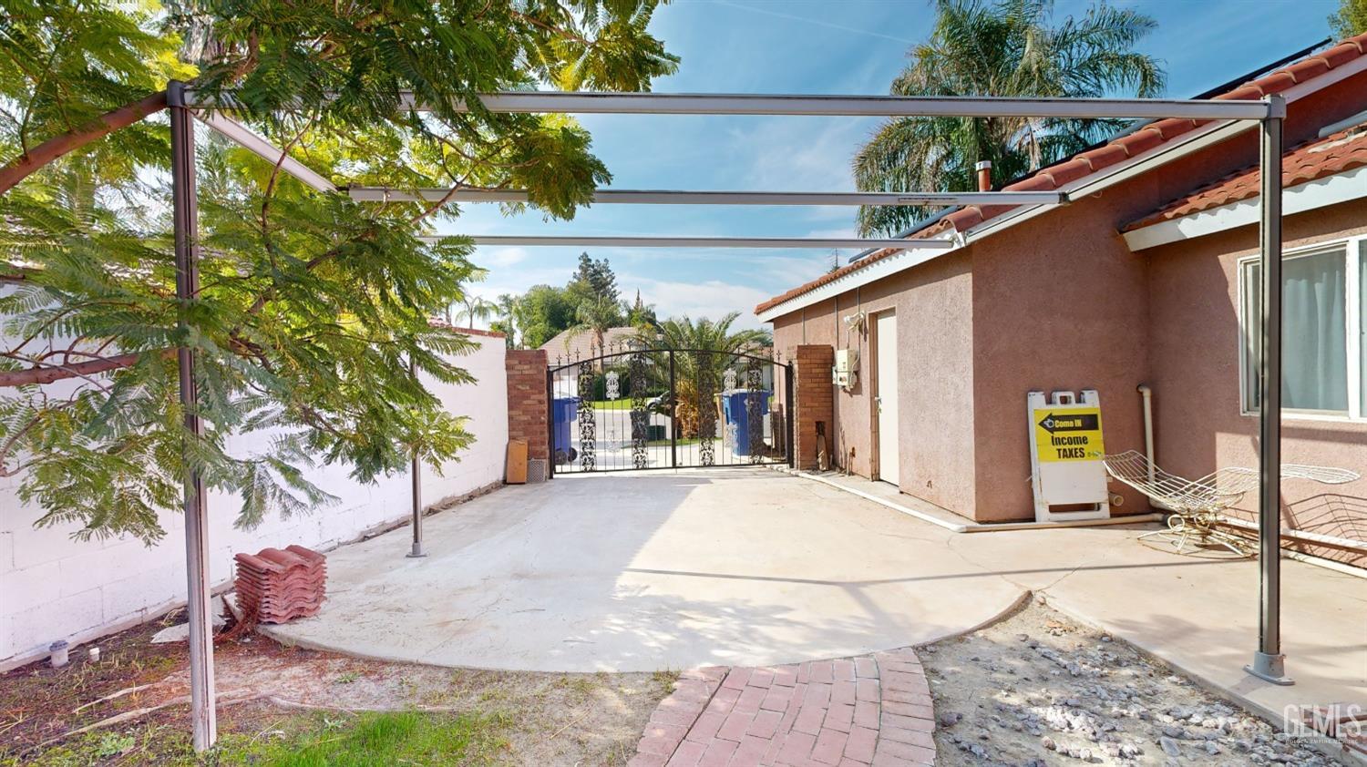 Undisclosed Address Bakersfield, CA 93313 - Photo 32 of 37 a view of a house with a tree