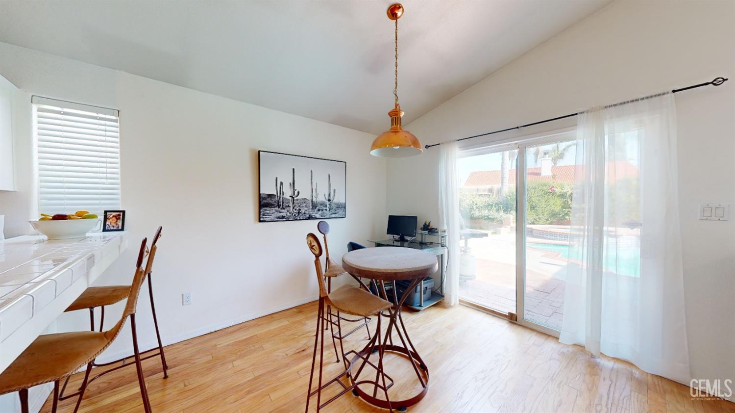 Undisclosed Address Bakersfield, CA 93313 - Photo 7 of 37 a workspace with furniture window and wooden floor
