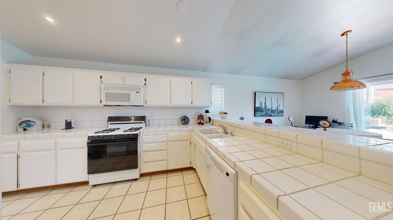 Undisclosed Address Bakersfield, CA 93313 - Photo 8 of 37 a kitchen with stainless steel appliances kitchen island sink refrigerator stove and cabinets