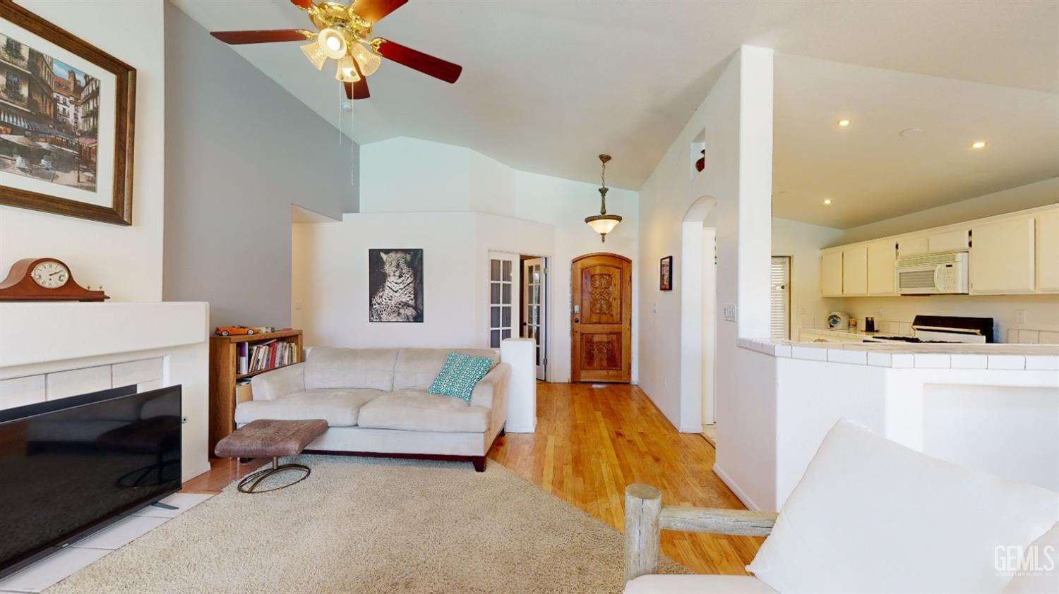 Undisclosed Address Bakersfield, CA 93313 - Photo 10 of 37 a living room with furniture and a fireplace