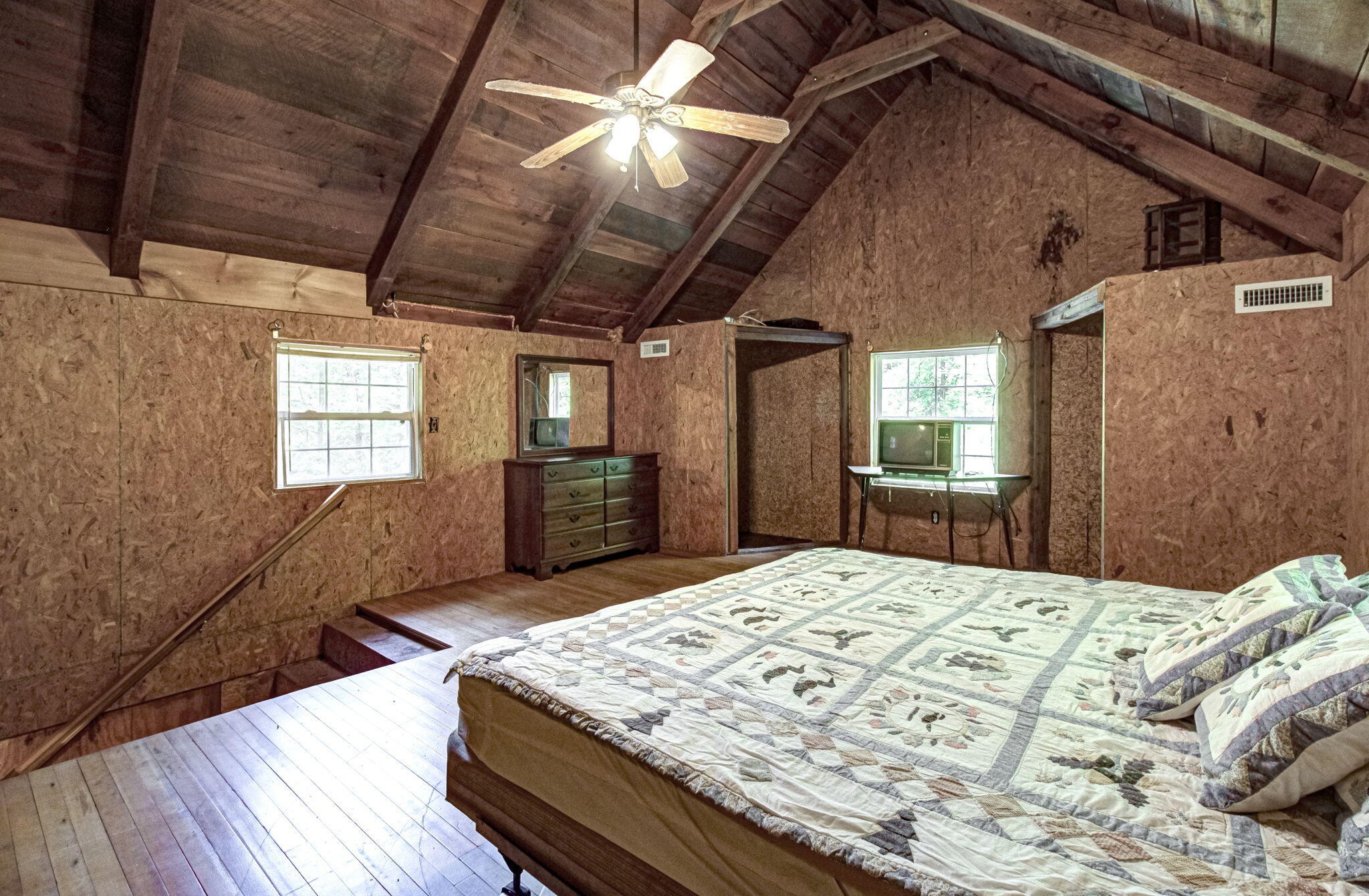 230 Big Towee Road Reliance, TN 37369 - Photo 16 of 69 a bed sitting in a bedroom next to a window