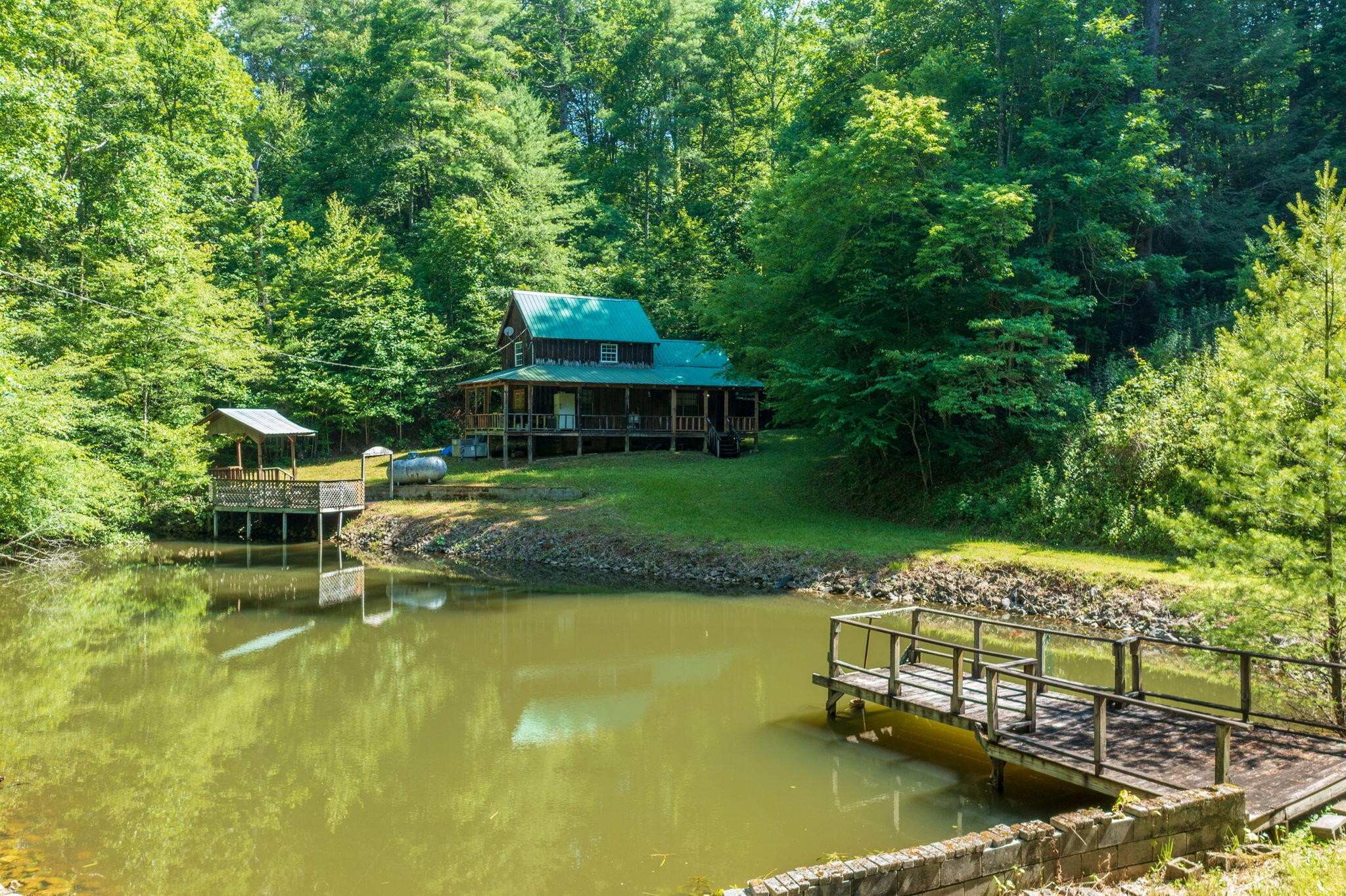 230 Big Towee Road Reliance, TN 37369 - Photo 21 of 69 an aerial view of a house with swimming pool patio and lake view