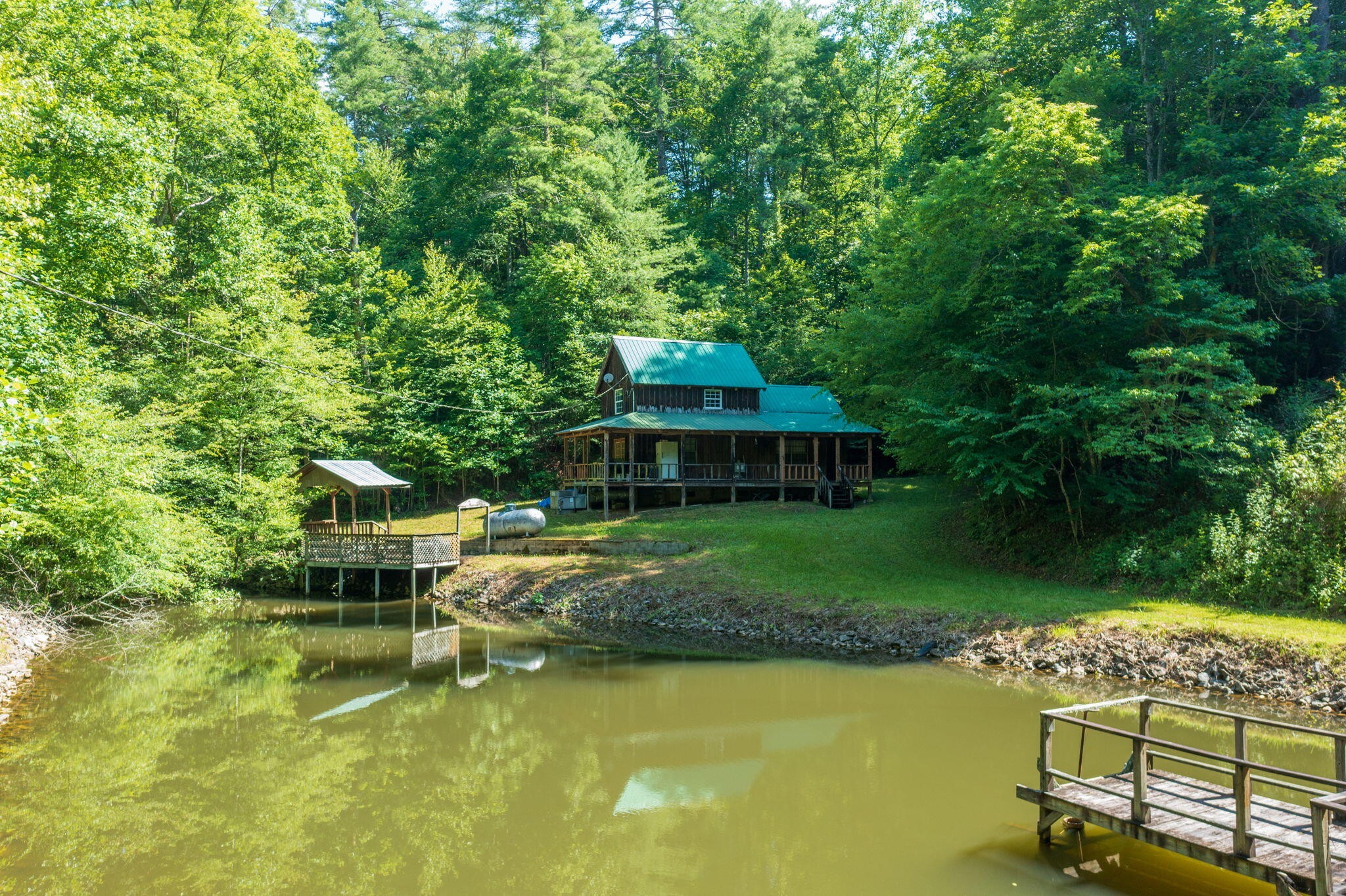 230 Big Towee Road Reliance, TN 37369 - Photo 22 of 69 a view of a house with swimming pool next to a yard