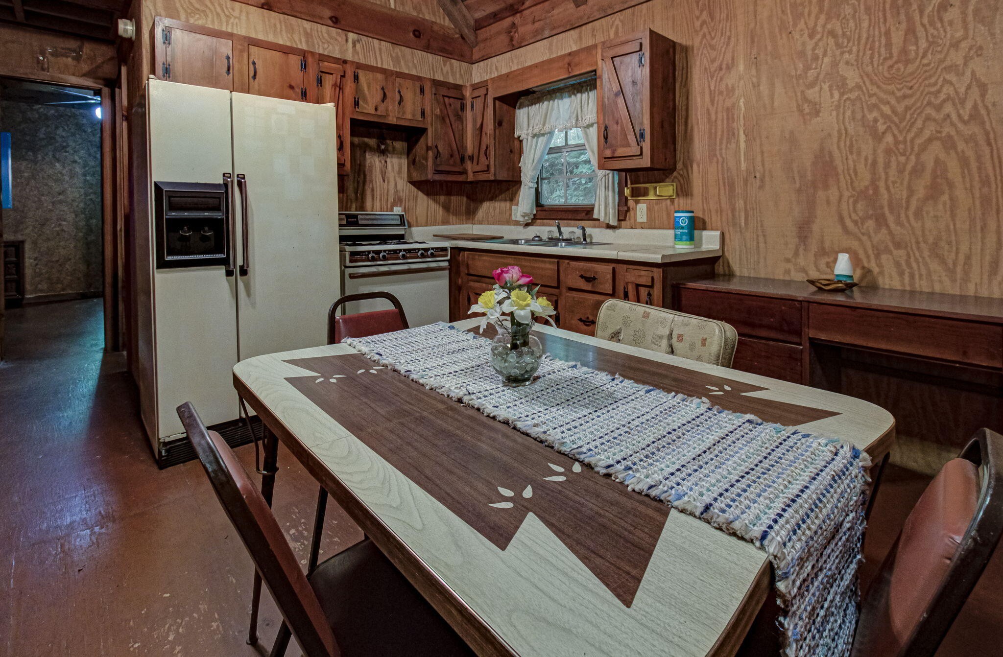230 Big Towee Road Reliance, TN 37369 - Photo 3 of 69 a kitchen with a table chairs and refrigerator