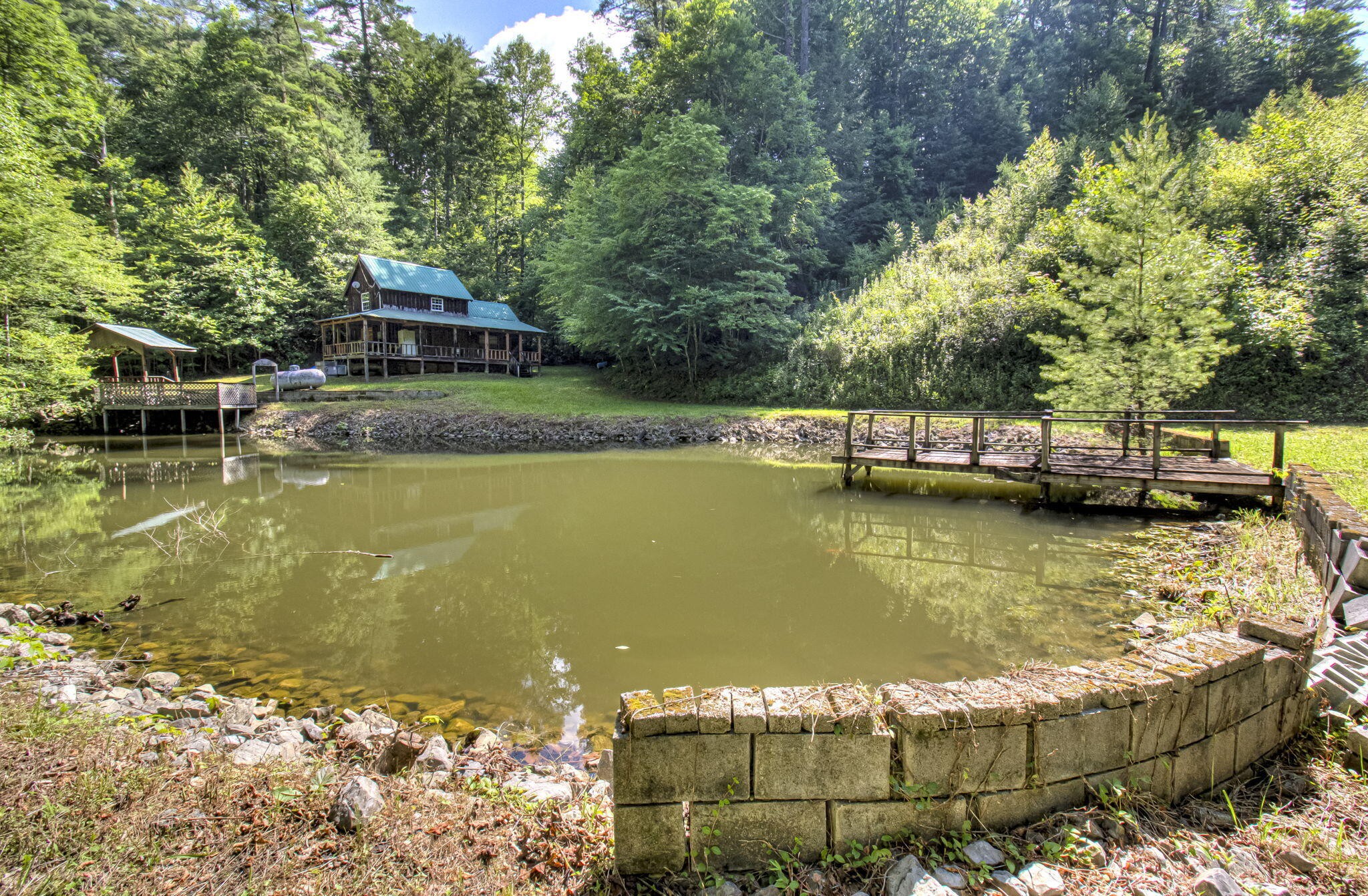 230 Big Towee Road Reliance, TN 37369 - Photo 52 of 69 a view of a lake with a house